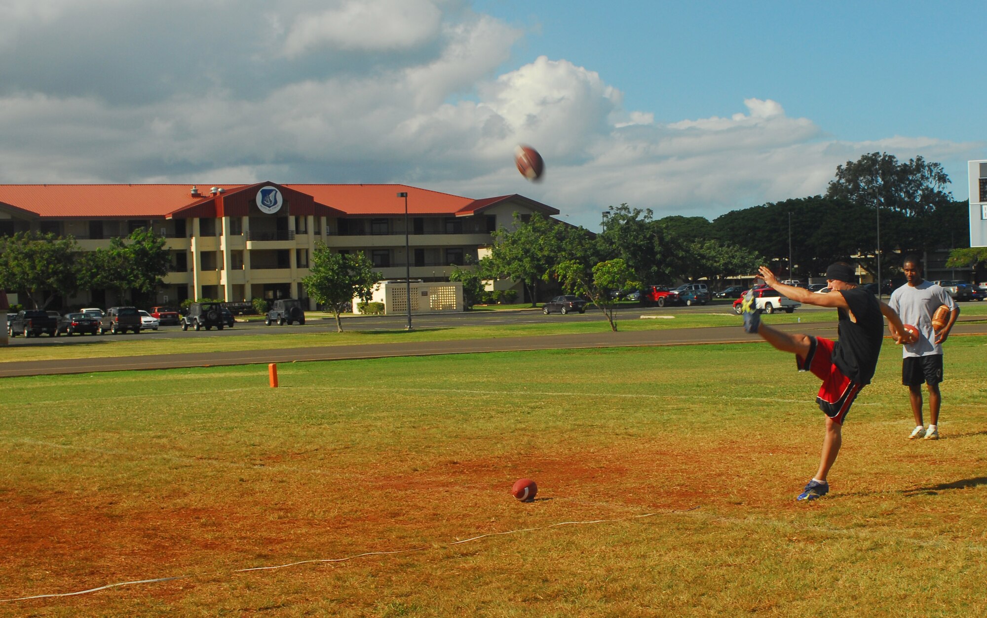 Gabriel Gustafson punts the ball during the Team Hickam tryouts for the  Air Force team at the Pro Bowl Military challenge at Kapiolani Park, Feb. 8 from 3 to 6 p.m. About 15 people tried out for the Air Force’s team and 7 will go on to compete at the Military Challenge. The AF team will be announced next week. Photo by Staff Sgt. Erin Smith