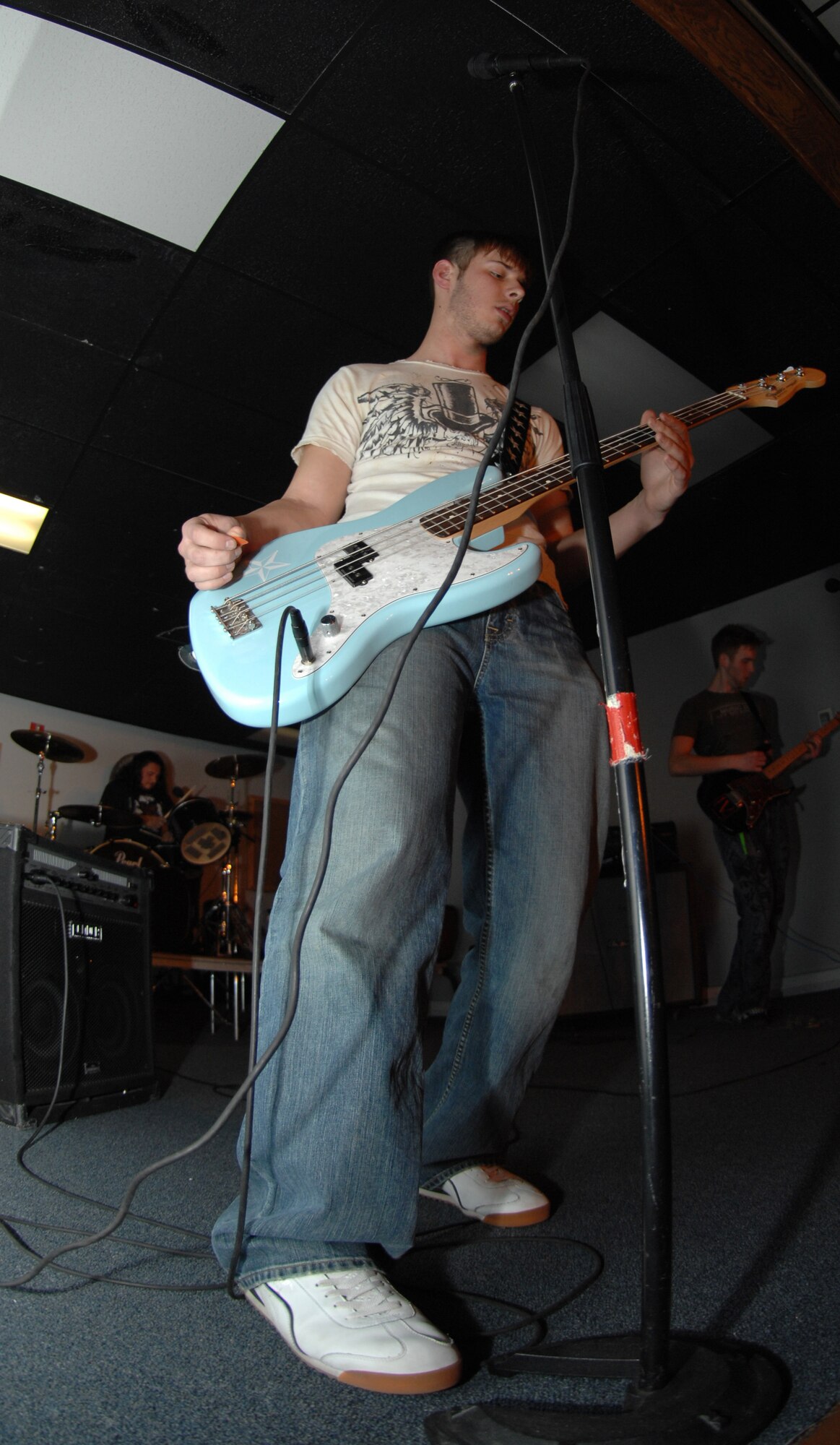 CANNON AIR FORCE BASE, N.M. - Jim Bailey plays the guitar during his band's set at the battle of the bands at the End Zone Jan. 18. His band, Cause and Effect, took first place for the third consecutive time. (U.S. Air Force photo by Airman Basic Maynelinne De La Cruz)
