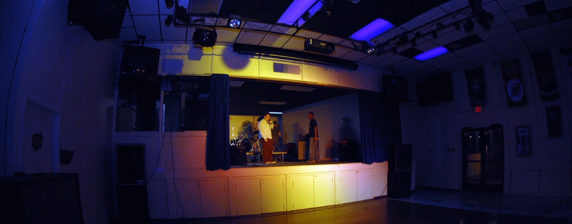 CANNON AIR FORCE BASE, N.M. - The band Jahallarah sets up their equipment so they can begin their set in the battle of the bands at the End Zone Jan. 18. The band Cause and Effect took first place.(U.S. Air Force photo by Airman 1st Class Evelyn Chavez)