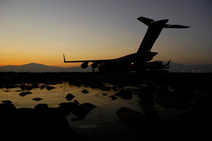 A C-17 Globemaster III is loaded with bundles for a Joint Precision Airdrop Delivery System of 40 bundles of humanitarian supplies Jan. 14 at Bagram Air Base, Afghanistan. (U.S. Air Force photo/Master Sgt. Andy Dunaway) 
