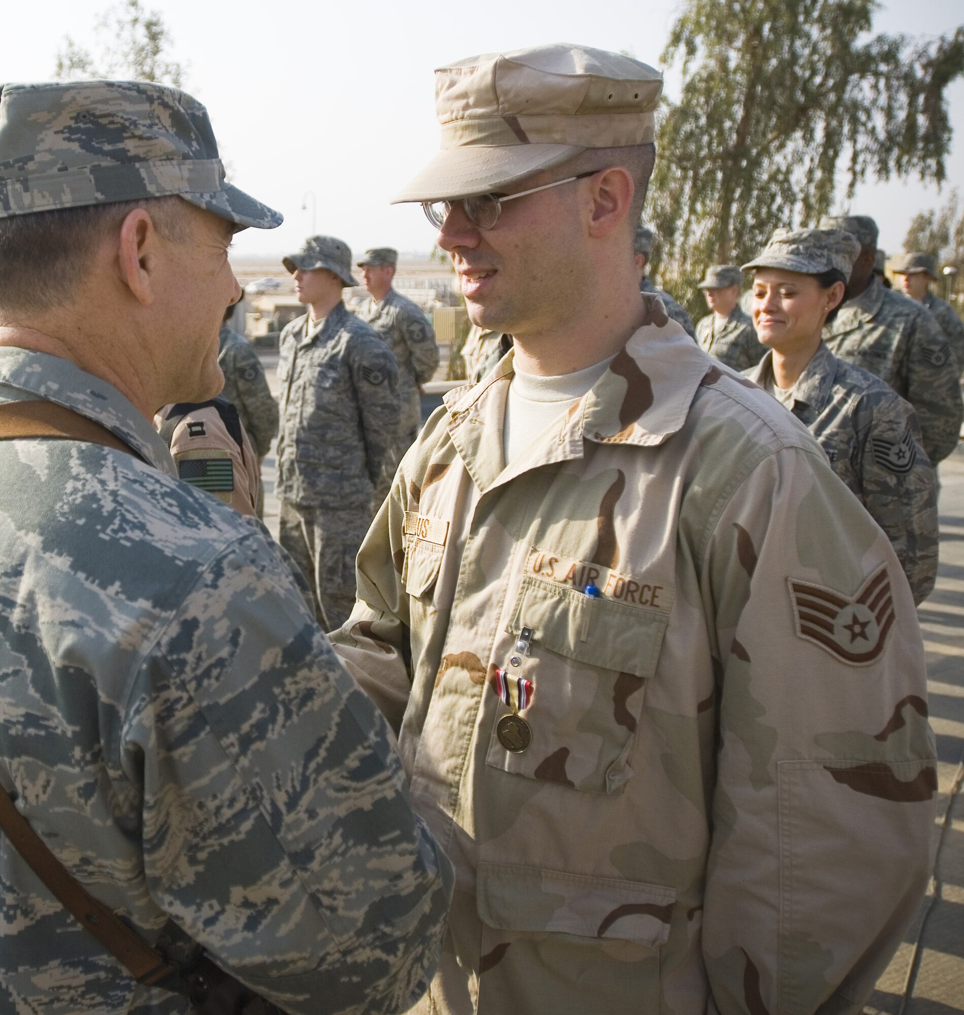 Staff Sgt. Robert Belus, deployed with the 332nd Air Expeditionary Wing, is awarded the Iraqi Campaign Medal at Balad Air Base, Iraq.  Sergeant Belus, who is assigned to the 71st Comptroller Squadron at Vance Air Force Base, was recently selected to attend U.S. Air Force Officers Training School. (U.S. Air Force photo)