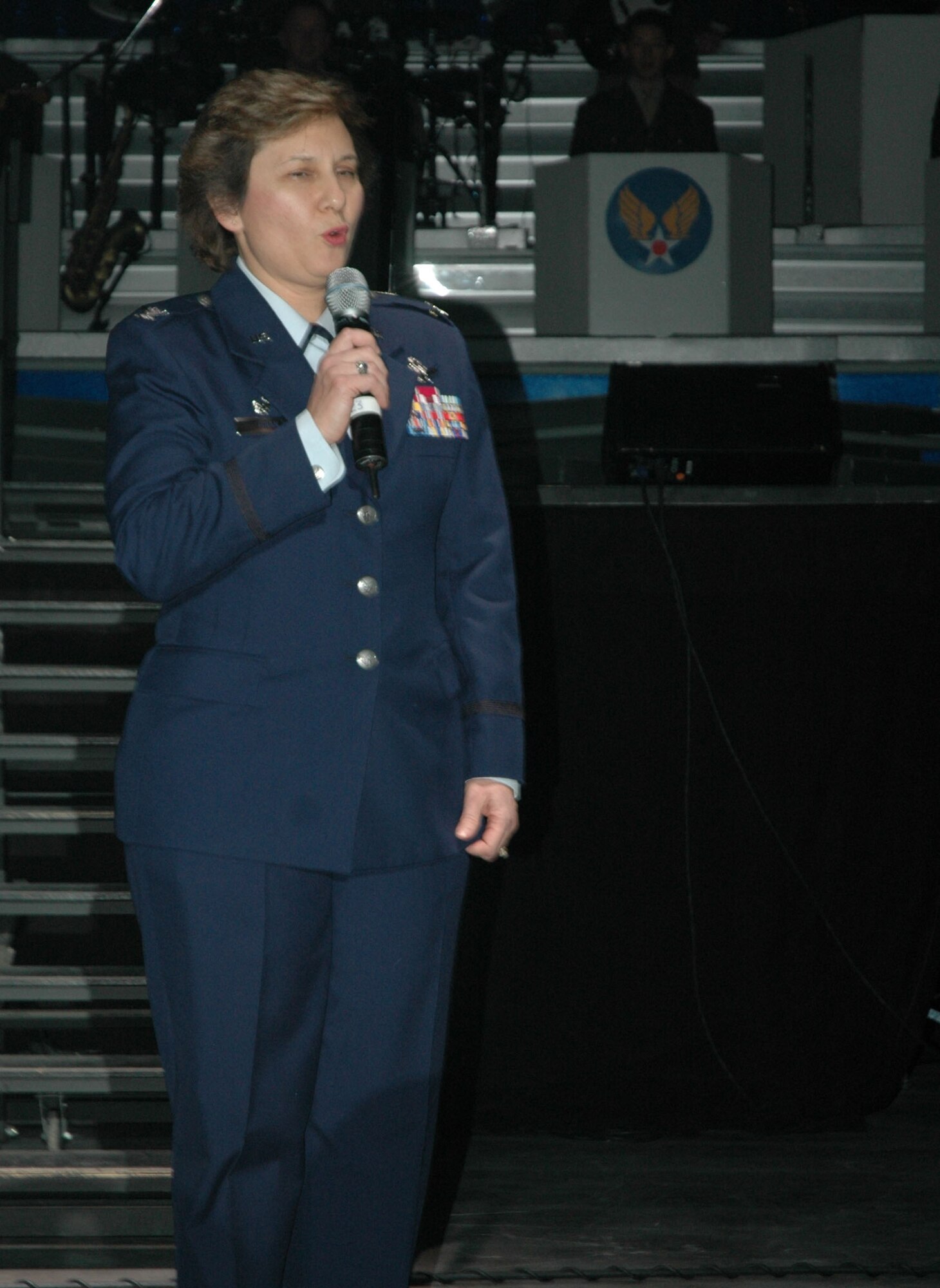 Col. Sandy Finan, 341st Space Wing commander, delivers an introduction speech prior to the 142nd Tops in Blue performance of the year at the Four Season's Arena in Great Falls Jan. 22. Tops in Blue is an all active-duty U.S. Air Force special unit comprised of 28 members picked for their talents in entertaining. The group sets up their own equipment weighing in at about 60,000 pounds and performs at 160 locations per year including deployed locations such as Afghanistan and Kyrgyzstan. This year's theme is “The Fly-By”, commemorating the Air Force's 60th Anniversary. (U.S. Air Force photo/Airman 1st Class Dillon White)