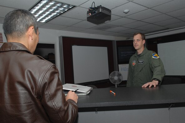 Maj. Joseph Rucker, 358th Fighter Squadron A-10 pilot, discusses flight operations on Jan. 15 at Davis-Monthan Air Force Base with Col. David Tanaka of 12th Air Force. The 358th FS prepares pilots for combat maneuvers, reconnaissance and surveillance missions. (U.S. Air Force photo/A1C Melissa Copeland)