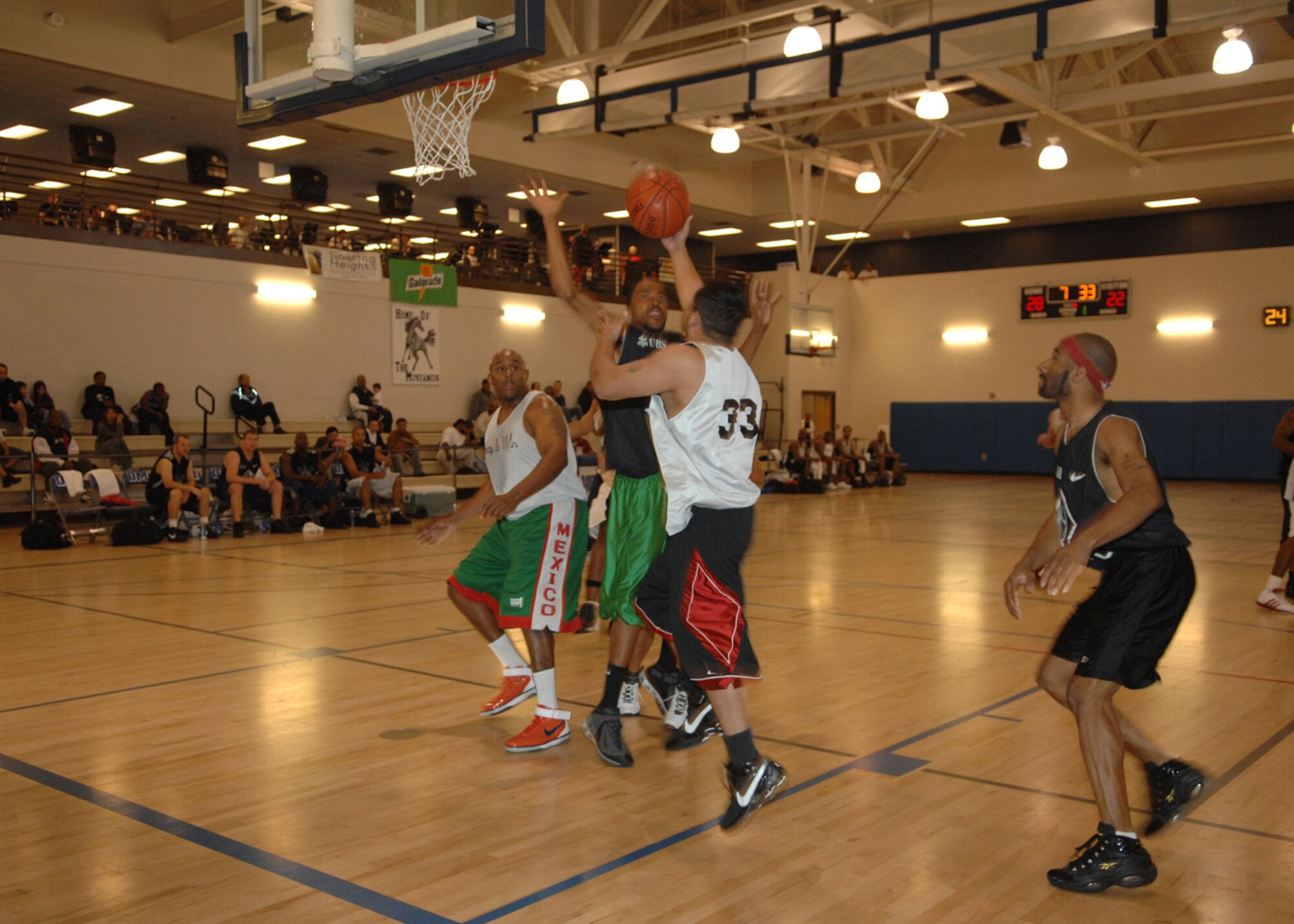 Members of teams Terror Squad and D & D Basketball square off at the net during the 22nd Annual Best in the West Basketball Tournament held Jan. 18-21 at the Fitness and Sports Center on Davis-Monthan Air Force Base. Team Terror Squad took the first place winner's slot after defeating team D & D Basketball Jan. 21. The D-M Mustangs placed third in the overall competition. (U.S. Air Force photo/A1C Melissa Copeland) (Released) 