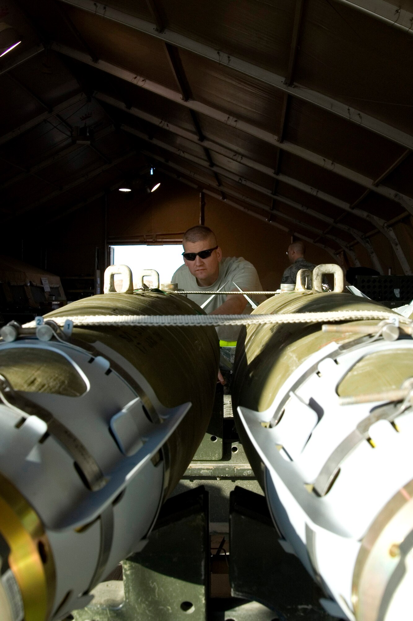 Master Sgt. Dave Jamison performs final inspections on munitions before delivering them to the flightline Jan. 17 at Balad Air Base, Iraq. Munitions targeting is a deliberate, finite and refined process with strict and exact rules of engagement. Sergeant Jamison is a 332nd Expeditionary Maintenance Squadron noncommissioned officer in charge of conventional maintenance and deployed from Spangdahlem Air Base, Germany. (U.S. Air Force photo/Staff Sgt. Travis Edwards)