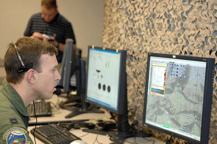Capt. Steven Gadoury, 6th Combat Training Squadron chief of academics, controls a training demonstration for the new Joint Terminal Attack Controller Virtual Training dome here, Jan. 17.  The dome will soon be incorporated into the syllabus for Nellis' JTAC students. (U.S Air Force photo by Staff Sgt. Taylor Worley)