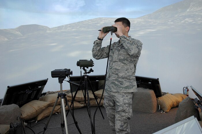 1st Lt. Clinton J. Kam, Air Force Research Laboratory, tests equipment in the new Joint Terminal Attack Controller Virtual Training dome prior to a ribbon cutting ceremony here, Jan. 17. The dome will soon be incorporated into the syllabus for Nellis' JTAC students. (U.S Air Force photo by Staff Sgt. Taylor Worley)
