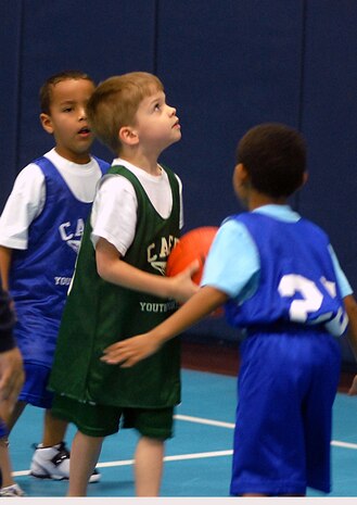 Calvin Watkins, 5, prepares to shoot a basketball at the Charleston AFB Youth Center Jan. 20. (U.S. Air Force photo/Tech. Sgt. Paul Kilgallon)