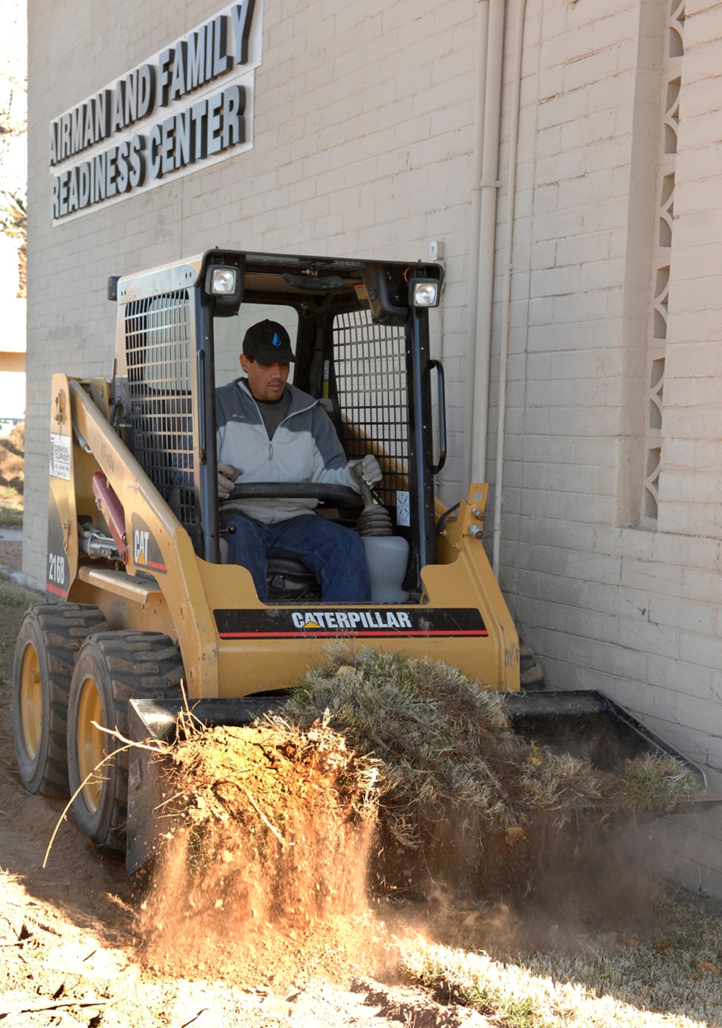 The 99th Civil Engineer Squadron works to replace water-dependent landscape with more drought-tolerant xeriscape around the Airmen and Family Readiness Center, here Dec. 27. The on-going construction around base is part of a new plan to conserve water and energy. The project helped secure the 2007 Air Force Energy Conservation Award for the squadron. (U.S Air Force photo by Airman Stephanie Rubi)
