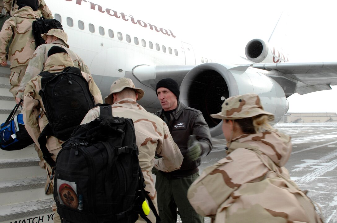 Colonel Scott Vander Hamm, 28th Bomb Wing Commander, shakes hands with deploying Airmen at Ellsworth Air Force Base, S.D., Jan. 21, 2008.  More than 200 Ellsworth Airmen deployed to Southwest Asia in support of Operations IRAQI FREEDOM and ENDURING FREEDOM. (U.S. Air Force photo/SrA Angela Ruiz)