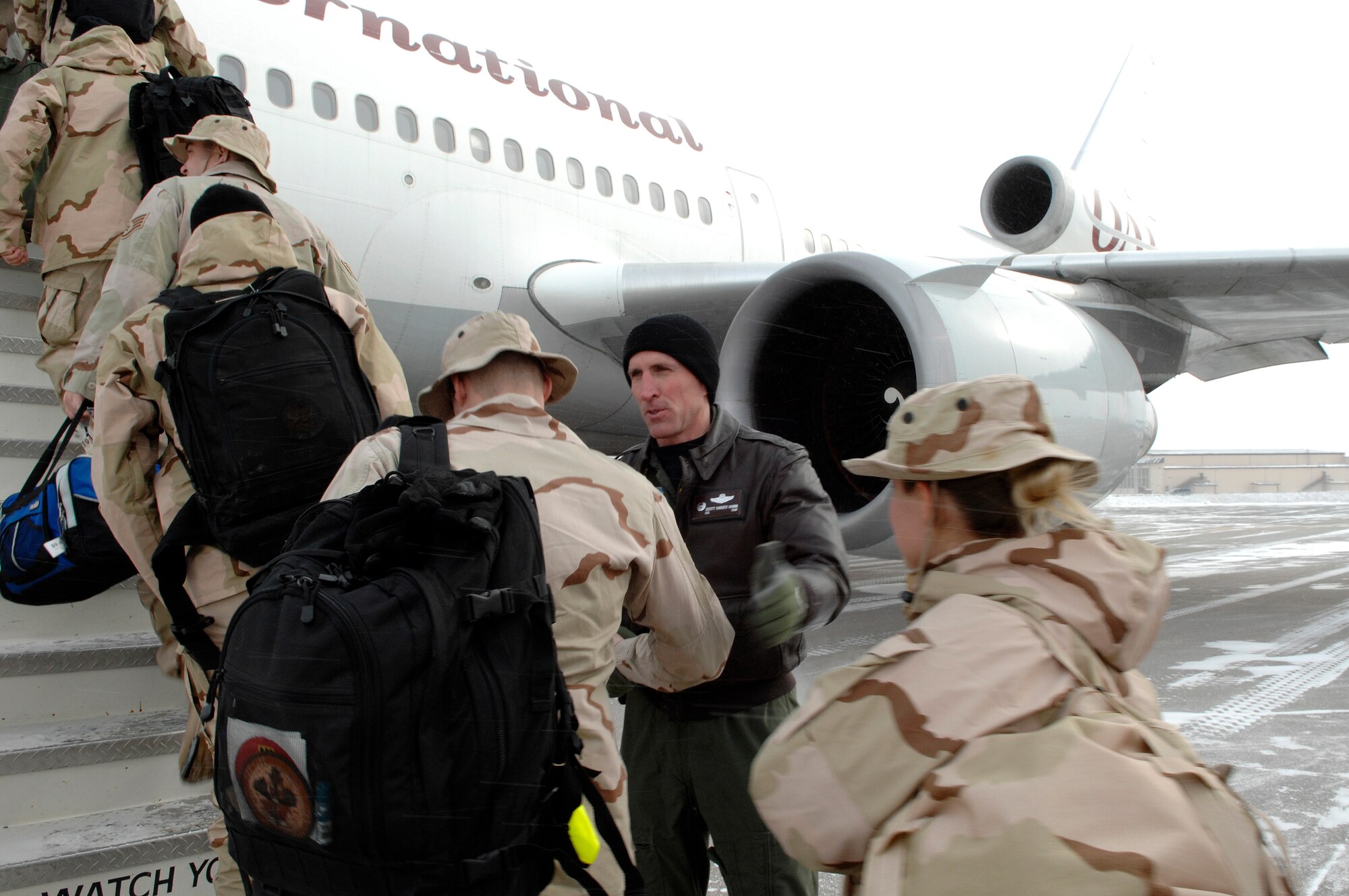 Colonel Scott Vander Hamm, 28th Bomb Wing Commander, shakes hands with deploying Airmen at Ellsworth Air Force Base, S.D., Jan. 21, 2008.  More than 200 Ellsworth Airmen deployed to Southwest Asia in support of Operations IRAQI FREEDOM and ENDURING FREEDOM. (U.S. Air Force photo/SrA Angela Ruiz)