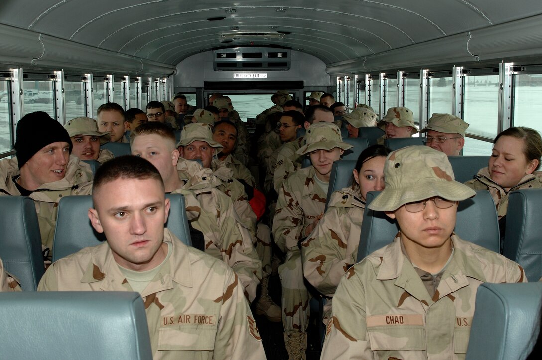 Members of the 28th Bomb Wing ride a bus to an awaiting aircraft during a deployment from Ellsworth Air Force Base, S.D., Jan. 21, 2008.  More than 200 Ellsworth Airmen deployed to Southwest Asia in support of Operations IRAQI FREEDOM and ENDURING FREEDOM. (U.S. Air Force photo/SrA Angela Ruiz)