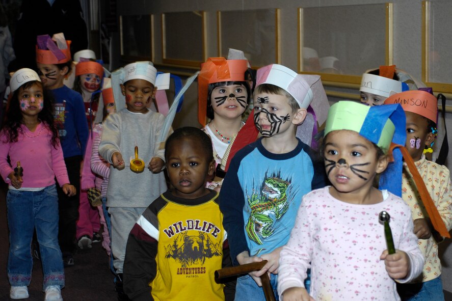 HANSCOM AFB, Mass. – Pre-school children from Room 9 at the Child Development Center had some face painting fun on Jan. 22. Pictured here students’ parade through the Center with their musical instruments serenading staff and children along the way. (U.S. Air Force photo by Linda LaBonte Britt)