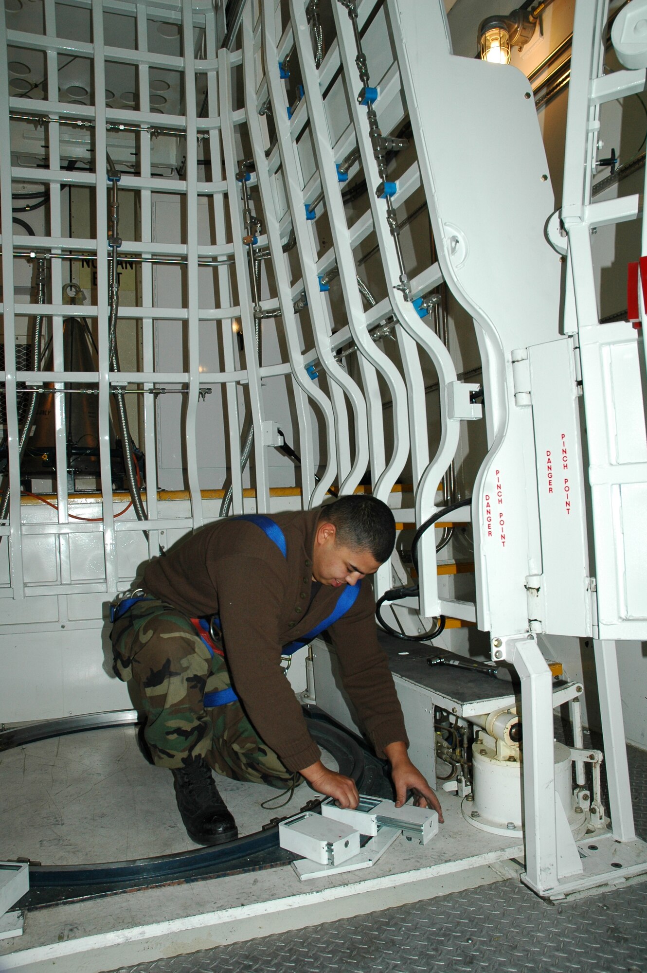 Senior Airman David Burress, 341st Missile Maintenance Squadron MMT member, adjusts equipment components in the Payload Transporter Type III Security Enhancement Program test that was conducted Jan. 9 to 16. A team from Vandenberg Air Force Base, Calif., and a team from Malmstrom held a series of tests to determine the system's efficiency. (U.S. Air Force photo/Airman 1st Class Emerald Ralston)