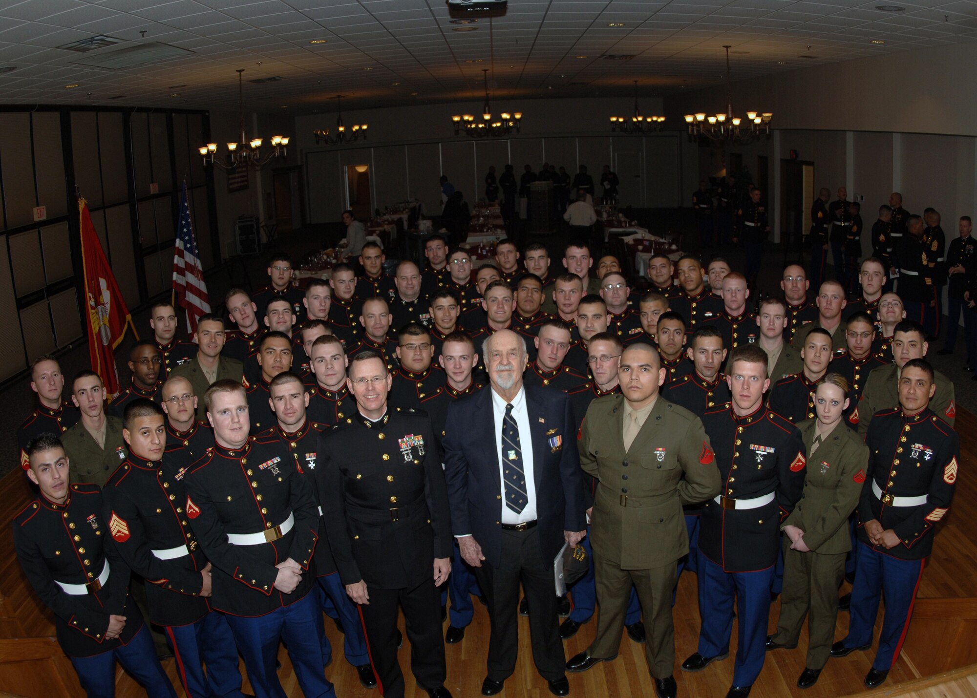 DYESS AFB, Texas-- Marines from Detatchment 1 Motor Transport Maintenence Company gather for a group photo at the Marine Corps Mess Night Jan 19. Among the Marines are Brigadier General Darrell Moore, Commander of the 4th Marine Logistics Group, and U.S. Marine Corps Retired, Major Keith Wells. (U.S. Air Force photo by Airman 1st Class Micheal Breaux)