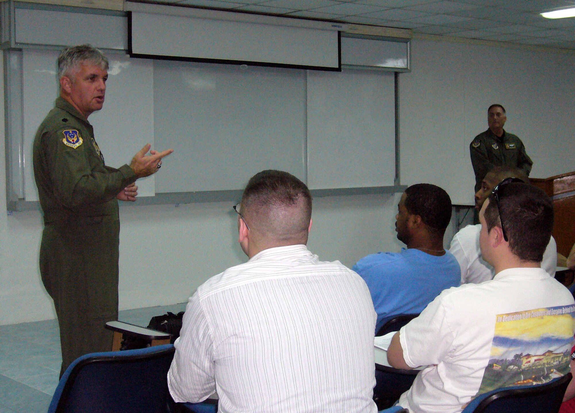 Lt. Col. Larry Germann (left) and Lt. Col. Don Herring (far right) brief members of the 51st Maintenance Group and 25th Fighter Squadron from Osan Air Base, South Korea, during their inprocessing Jan. 22 at Korat Royal Thai Air Base, Thailand. The 70 Osan AB members will participate in Exercise Cope Tiger '08, a Thai- and U.S.-sponsored multilateral joint and combined field training exercise and humanitarian and civic assistance exercise. Cope Tiger enhances combined readiness and interoperability, reinforces U.S. commitment to the Southeast Asian region, and demonstrates U.S. capability to project combined and joint forces strategically in a multilateral environment. Colonel Germann is the life fly cell director for Cope Tiger '08, and Colonel Herring is the 13th Air Force Air Expeditionary Wing vice commander. (U.S. Air Force photo/Capt. Renee H. Lee) 
