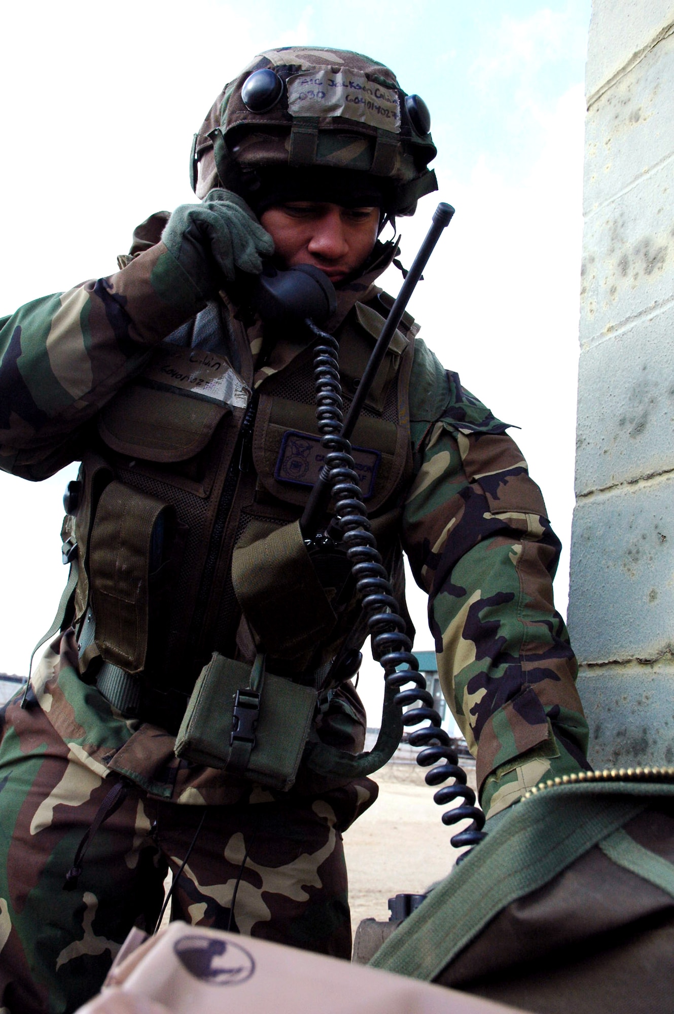 Airman 1st Class Jackson Calvin calls on a field phone during operations for Exercise Eagle Flag 08-2 Jan. 20 at Naval Air Engineering Station Lakehurst, N.J. Airman Calvin is a security forces Airman from the 60th Security Forces Squadron from Travis Air Force Base, Calif. The exercise is operated by members of the Air Force Expeditionary Center's Expeditionary Operations School and 421st Combat Training Squadron at Fort Dix, N.J. (U.S. Air Force photo/Tech. Sgt. Scott T. Sturkol) 
