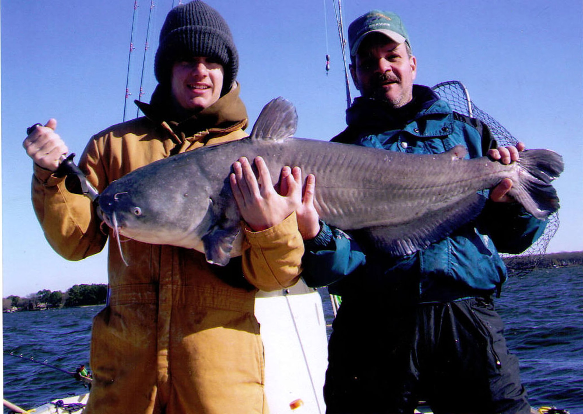 Mitchell Kimbrough and his father, Air Force Reserve recruiter Master Sgt. Kelly Kimbrough, hold the record-setting blue catfish caught Dec. 31, 2007 in Texas. (Courtesy photo)
