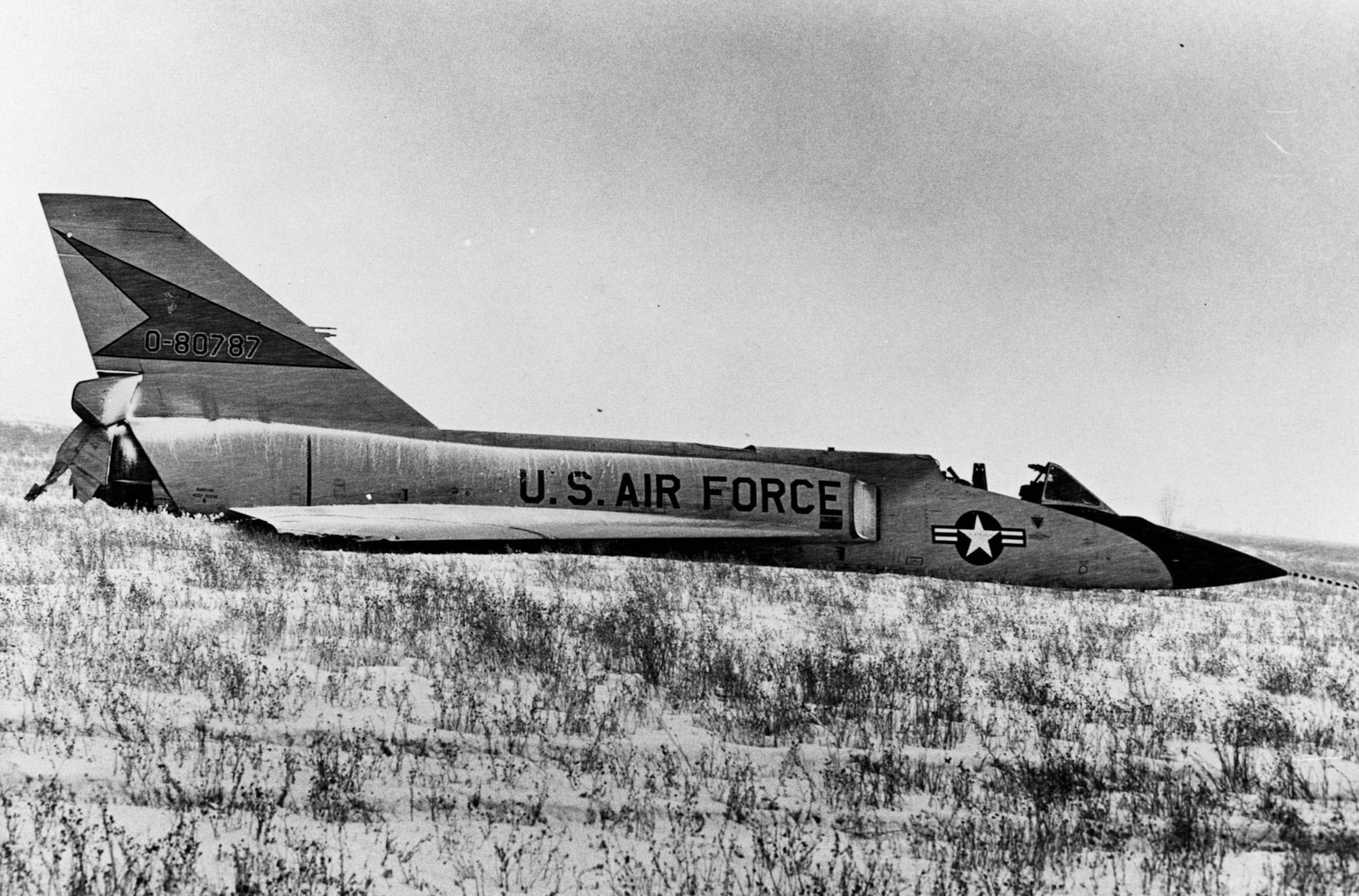 This F-106A (S/N 58-0787) was involved in an unusual incident. During a training mission, it entered an flat spin forcing the pilot to eject. Unpiloted, the aircraft recovered on its own and miraculously made a gentle belly landing in a snow-covered field. (U.S. Air Force photo)