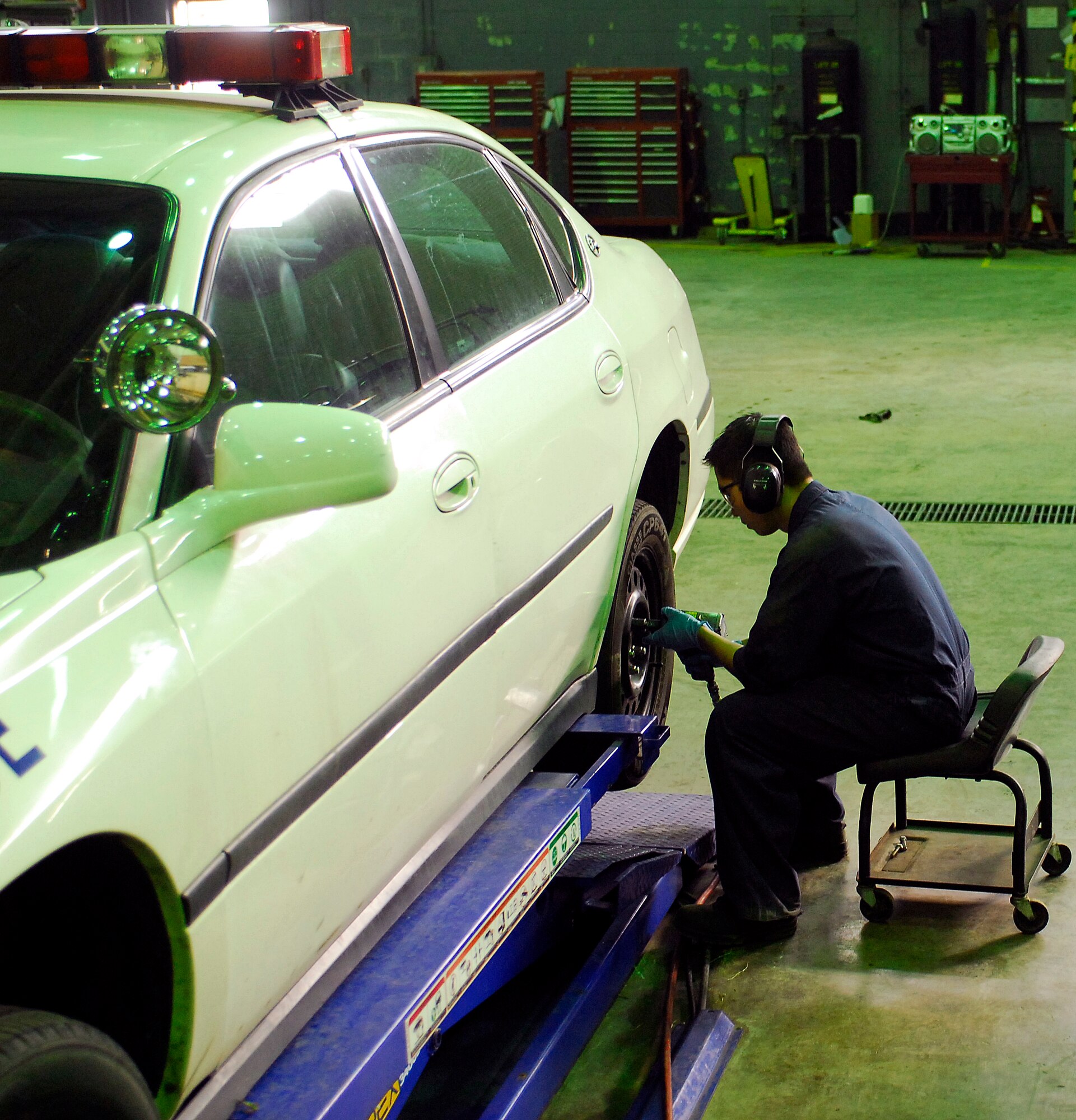 KUNSAN AIR BASE, South Korea -- Senior Airman Hung-Gia Nguyen, 8th Logistic Readiness Squadron vehicle maintenance journeyman rotates tires on a vehicle Jan. 24 here. The 8th LRS maintenance flight repairs and maintains various types of vehicles to ensure the Wolf Pack stays mobile. (U.S. Air Force photo/Senior Airman Giang Nguyen)