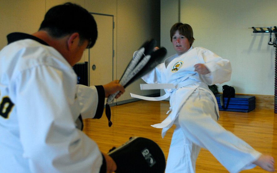 KUNSAN AIR BASE, South Korea -- Staff Sgt. Melissa Yetkin, 20th Equipment Maintenance Squadron, Shaw Air Force Base, practices Tang Soo Do kicking techniques Jan. 24 here.  Tang Soo Do class is part of the fit to fight programs designed to improve Airmen's physical well being offered by the base fitness center. (U.S. Air Force photo/Senior Airman Giang Nguyen)