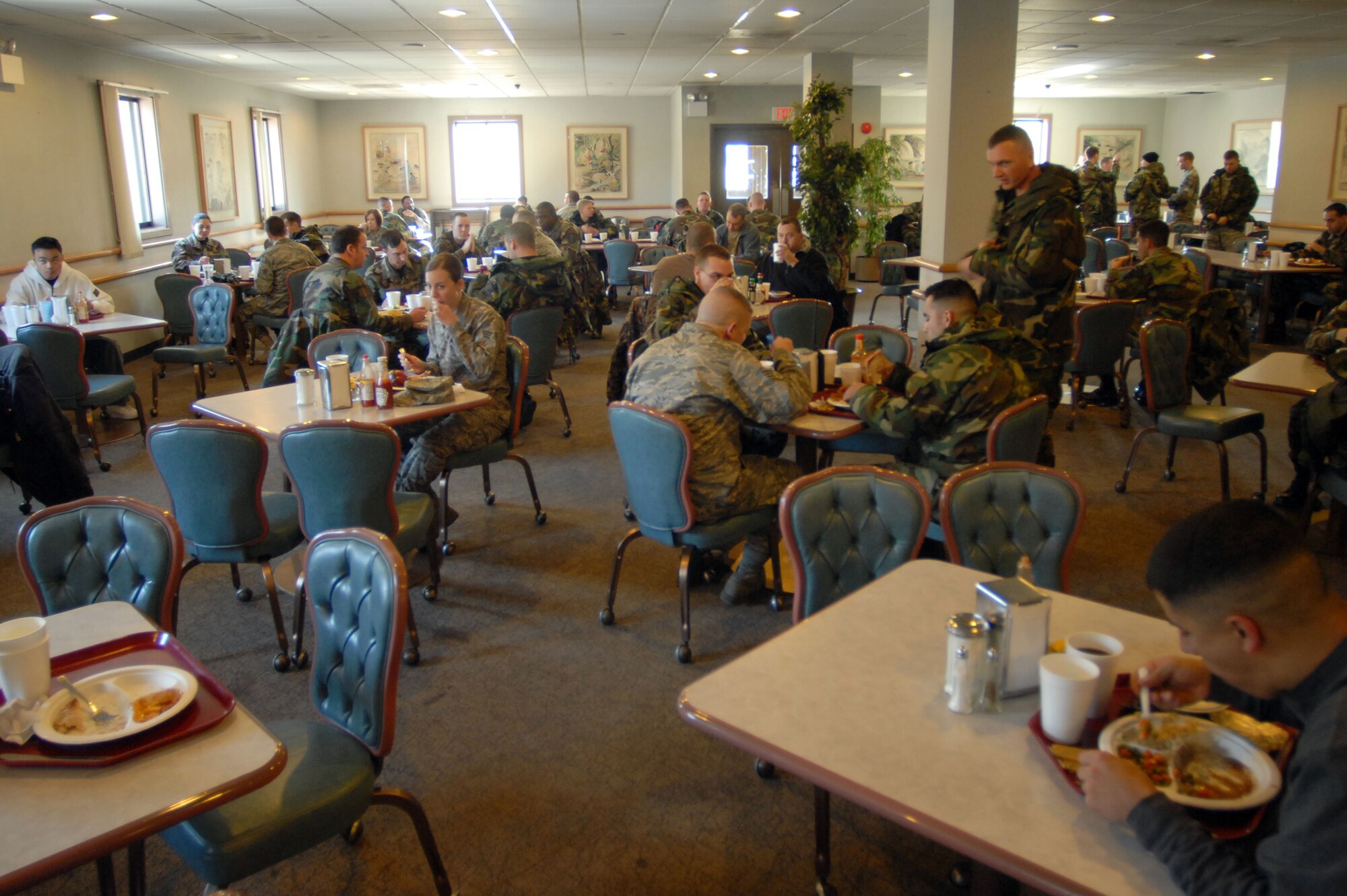 KUNSAN AIR BASE, South Korea -- Airmen and Soldiers enjoy their lunch prepared by Pacific Architect Engineering Korea Limited employees at the O'Malley Dining Facility Jan. 24 here.  The O'Malley Dinging Facility is open for breakfast, lunch, dinner and a midnight meal for about 2,500 Airmen and Soldiers providing them the proper nutrition to remain mission ready. (U.S Air Force photo/Senior Airman Steven R. Doty) 