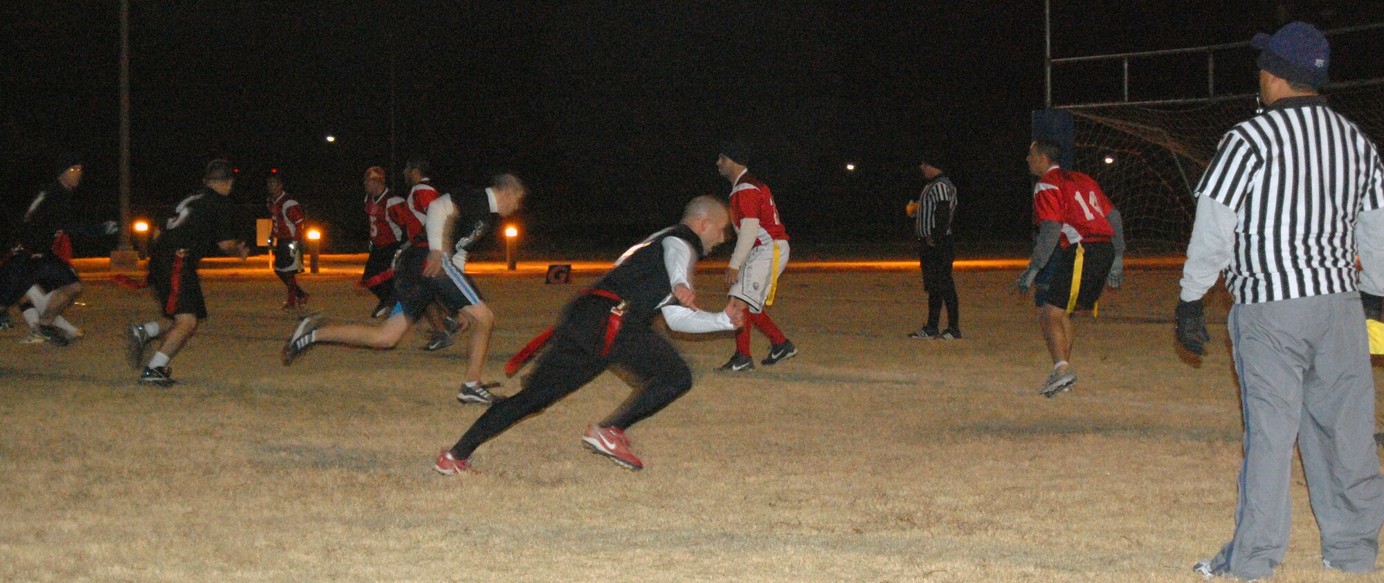 LAUGHLIN AIR FORCE BASE, Texas-- The 47th Civil Engineer Squadron defeats the AFGE during the flag football championship game Jan. 23.  This year’s flag football season consisted of ten teams from two different divisions, East and West.  After playing ten regular season games, all of the teams advanced to the playoffs, where their ultimate fate was determined by single elimination.  (U.S. photo by 2nd Lt. Courtney Kippenberger)
