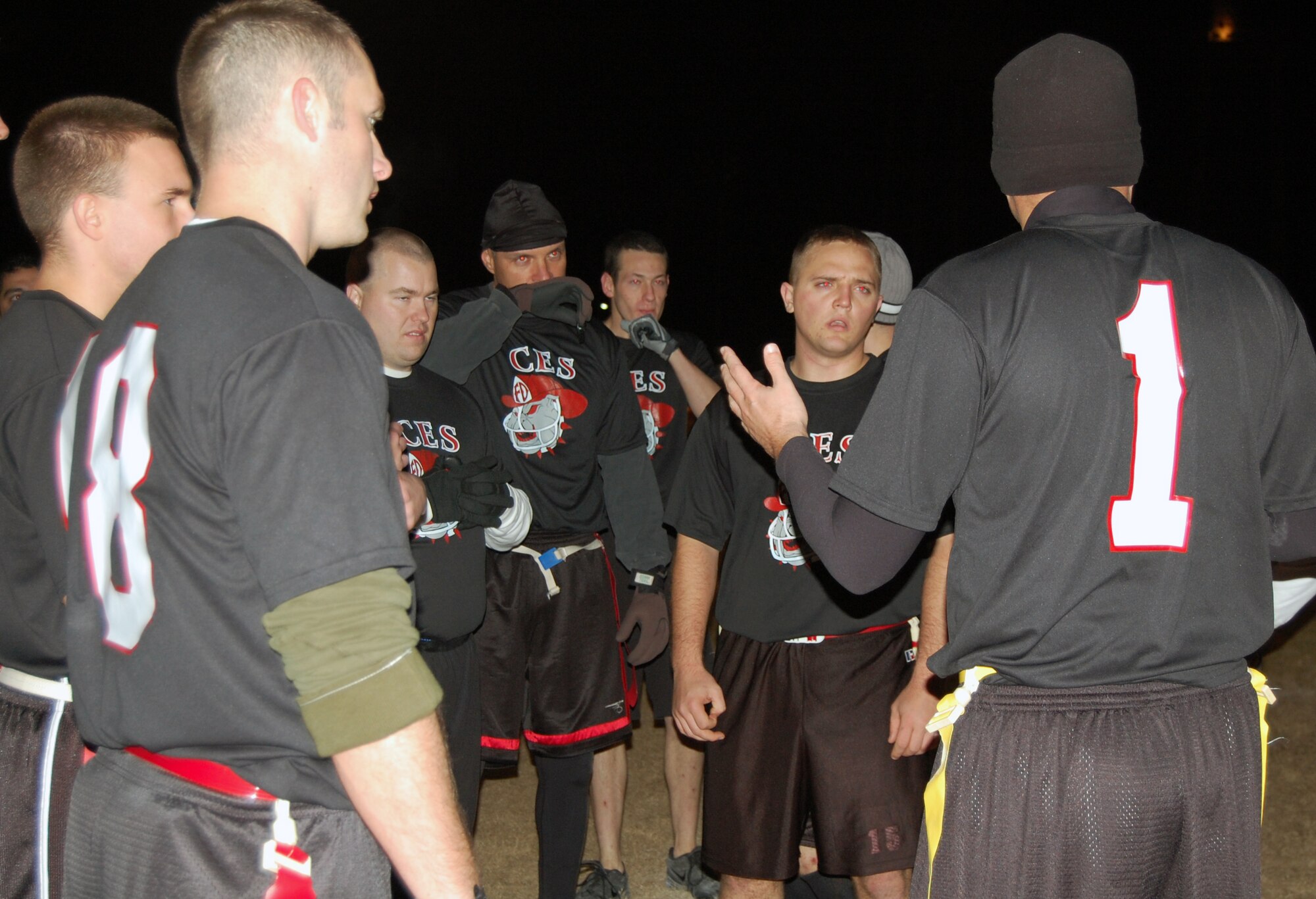 LAUGHLIN AIR FORCE BASE, Texas-- The 47th Civil Engineer Squadron discusses what adjustments they need to make after a scoreless first half during the flag football championship game Jan. 23.  This year’s flag football season consisted of ten teams from two different divisions, East and West.  After playing ten regular season games, all of the teams advanced to the playoffs, where their ultimate fate was determined by single elimination.  (U.S. photo by 2nd Lt. Courtney Kippenberger)