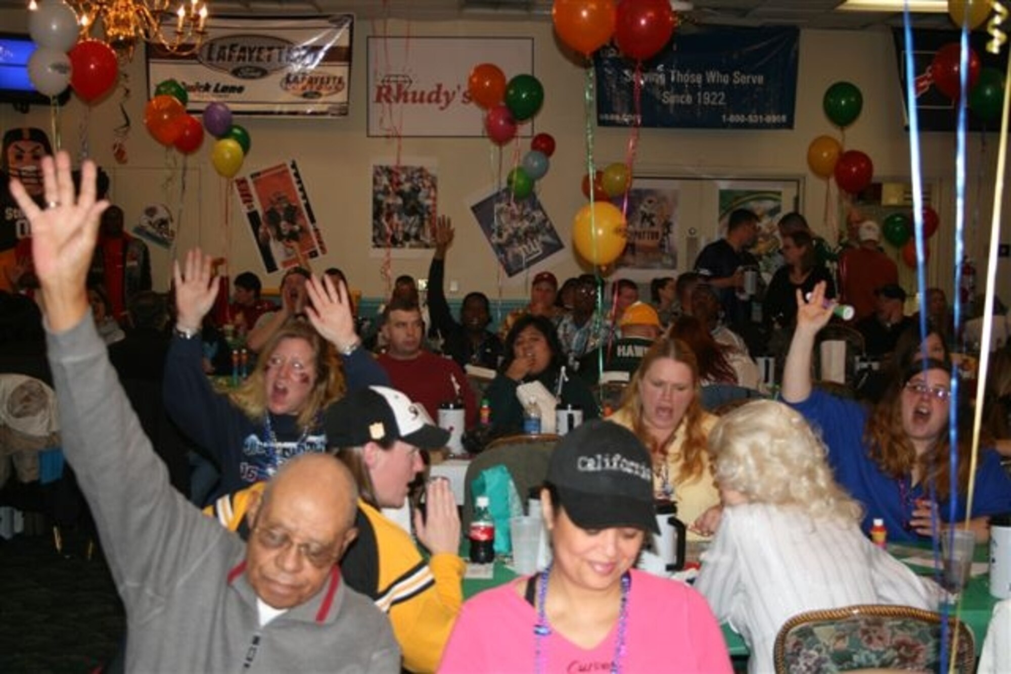 Members in the crowd in the ballroom at the Pope Club call out "Bingo" during Super Bowl Bingo Jan. 19. 