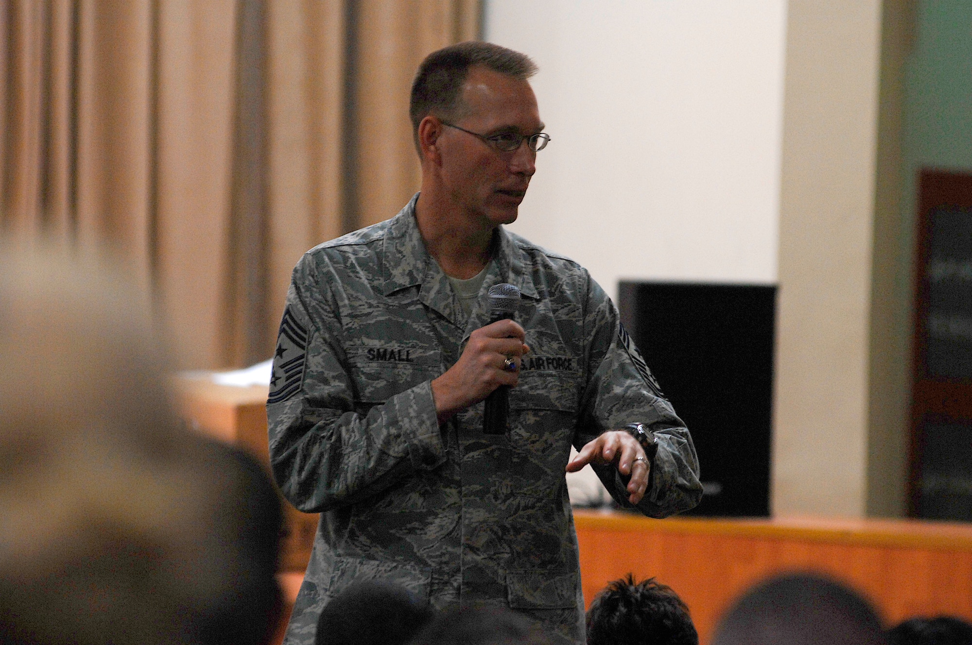 Chief Master Sgt. Todd Small talks to Airmen deployed to the 386th Air Expeditionary Wing Jan. 24, 2008, during an 'Enlisted Call' at an air base in the Persian Gulf Region. Chief Small is the Ninth Air Force and United States Central Command Air Forces Command Chief Master Sergeant to the Commander at Shaw Air Force Base, S.C. (U.S. Air Force photo/Senior Airman Patrick Dixon) 