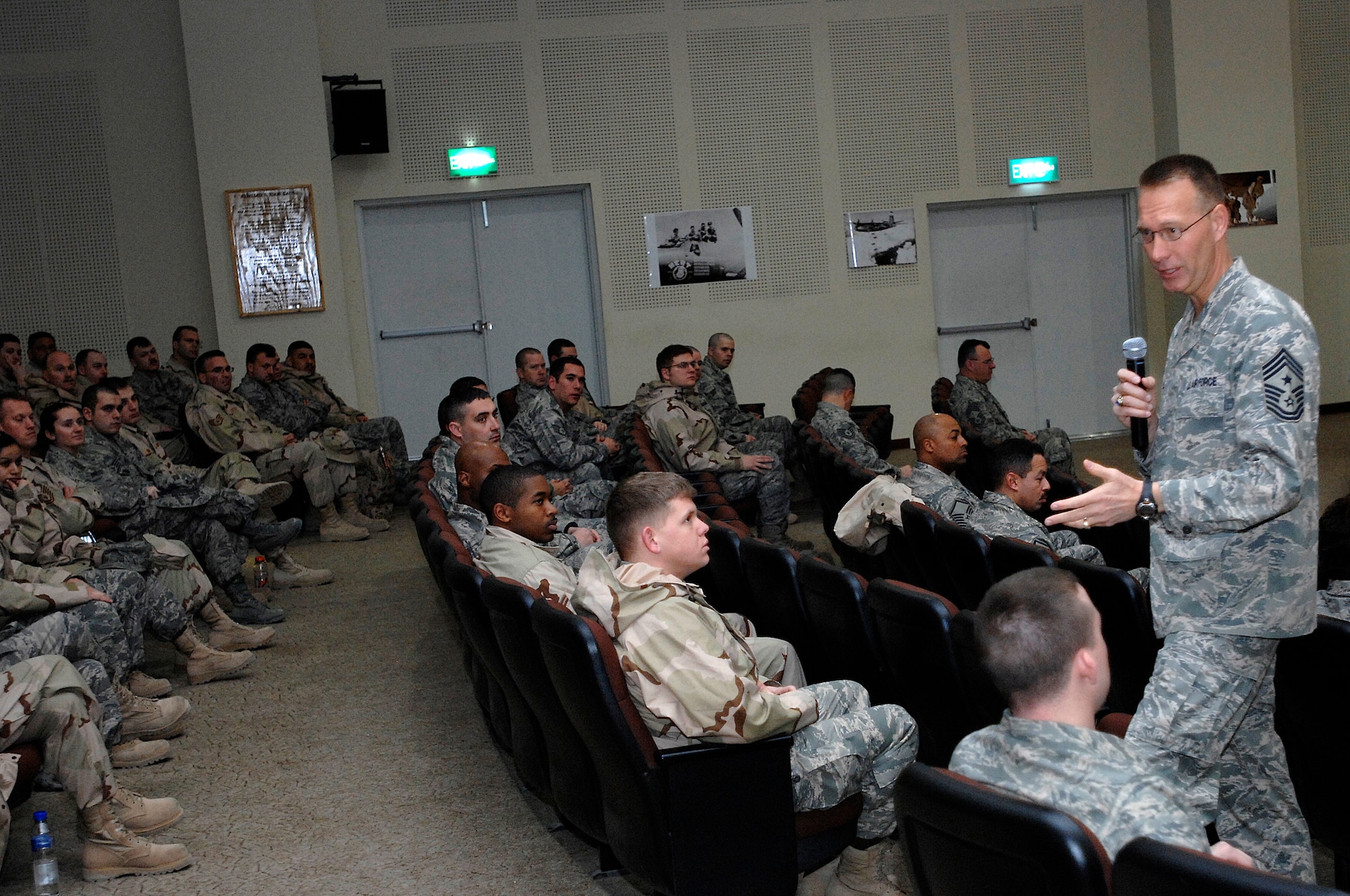 Chief Master Sgt. Todd Small talks to Airmen deployed to the 386th Air Expeditionary Wing Jan. 24, 2008, during an 'Enlisted Call' at an air base in the Persian Gulf Region. Chief Small is the Ninth Air Force and United States Central Command Air Forces Command Chief Master Sergeant to the commander at Shaw Air Force Base, S.C. (U.S. Air Force photo/Senior Airman Patrick Dixon)