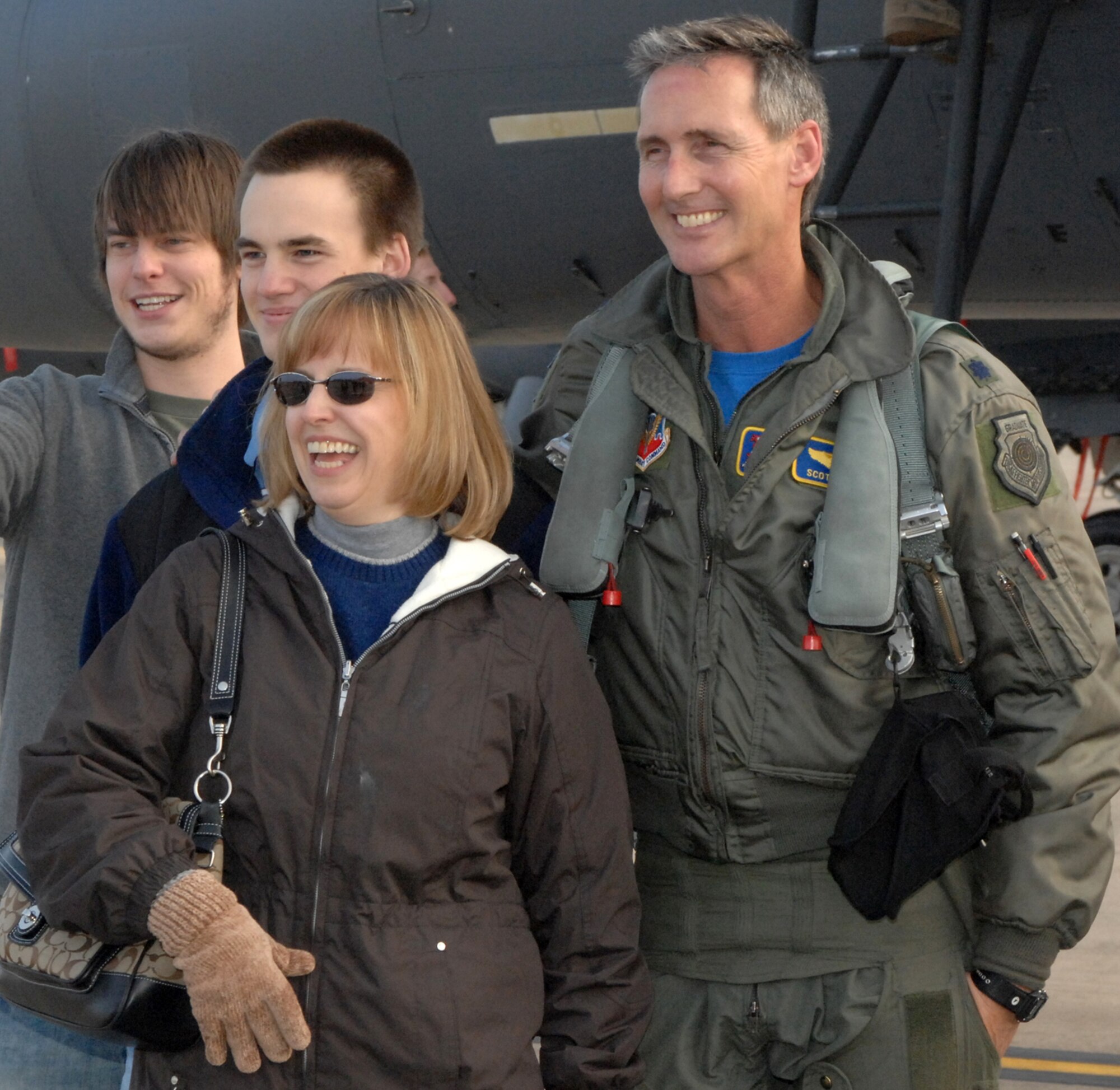 SEYMOUR JOHNSON AIR FORCE BASE, N.C. - Lieutenant Colonel Scott Purdie, 334th Fighter Squadron, stands with his family afterhe achieves his Three thousandth hour of flying. Lieutenant Colonel Scott Purdie plans to achieve six thousand or more hours of flight before he retires from the united States Air Force.(U.S. Air Force photo by Airman First Class Jonathon Williams)