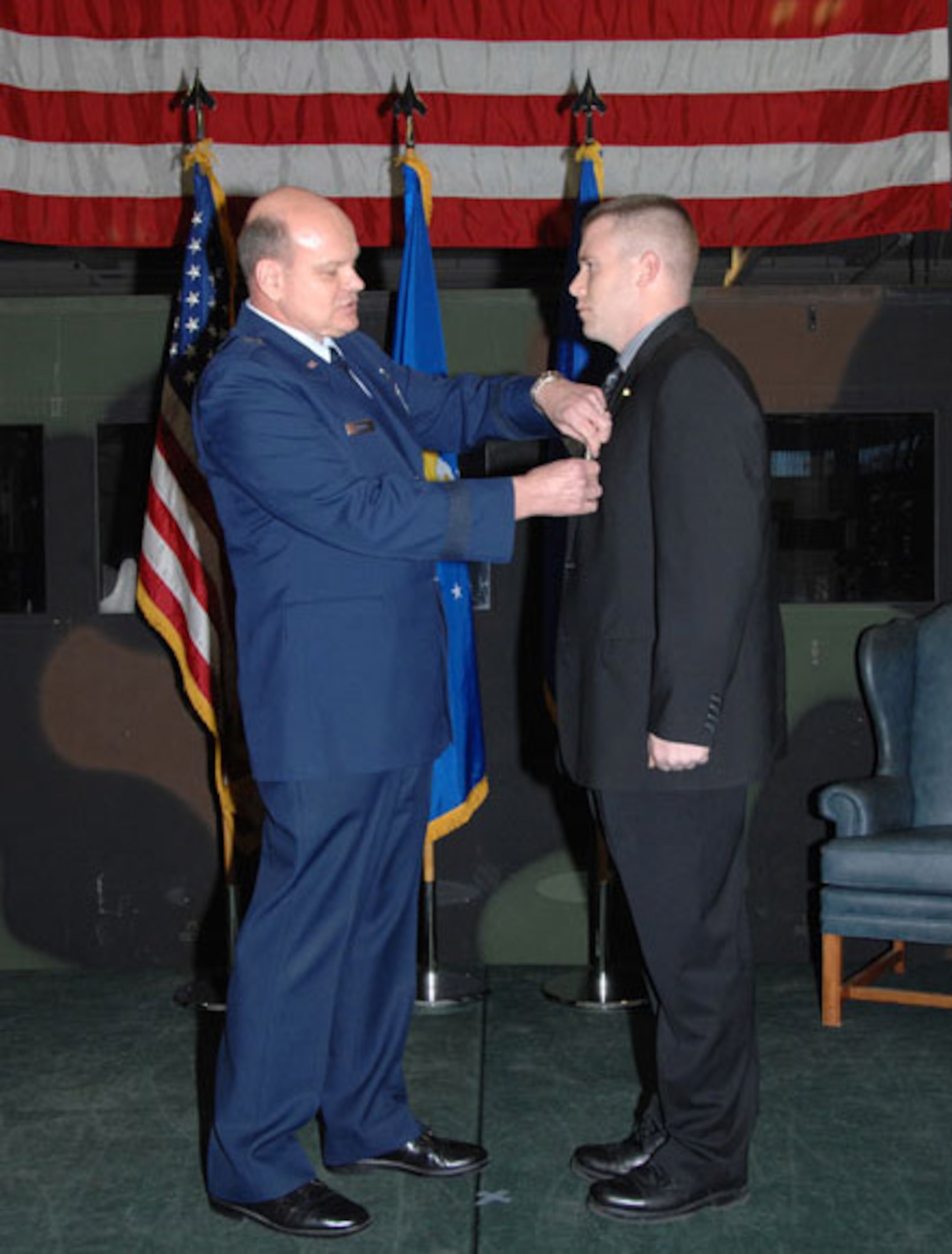 Air Force Office of Special Investigations Special Agent James Collins receives the Airman's Medal for rescuing troops in Iraq after a helicopter crashed into a lake. Special Agent Collins is credited with assisting in the rescue and life-saving efforts of 10 of the 14 passengers and crew. He also received the Bronze Start and Air Force Combat Action Medal for his efforts in accomplishing the mission in Iraq. (U.S. Air Force photo)