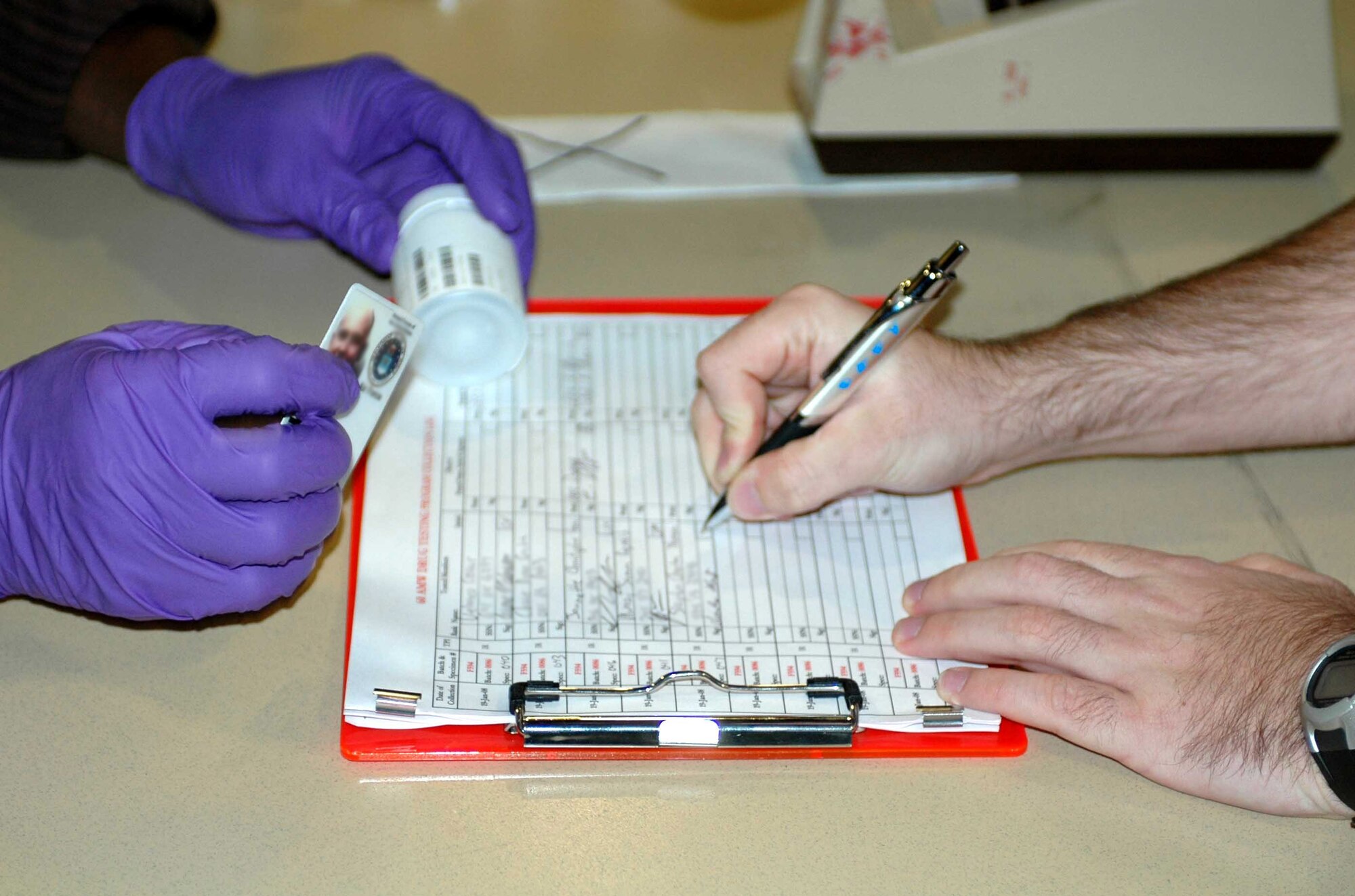 A Travis member reports for a urinalysis test during Operation Nighthawk Jan. 19. (U.S. Air Force photo/Tech. Sgt. Donald Osborn)