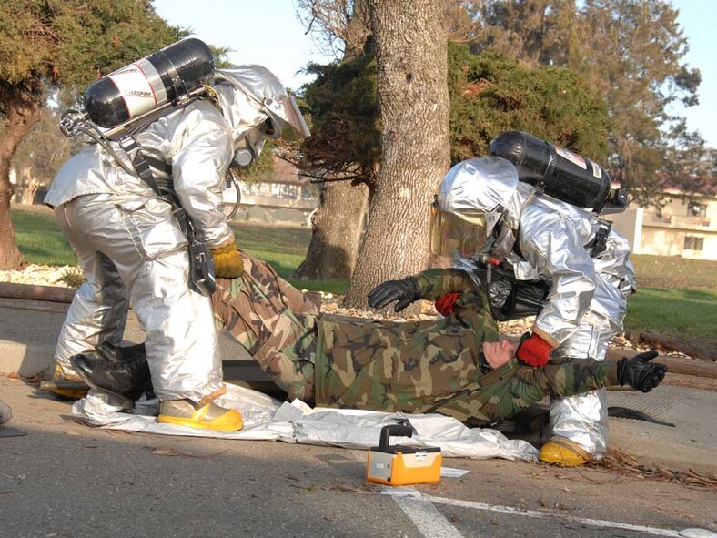 Emergency responders move a casualty during the Emergency Management Exercise Jan. 15. The EMX helped Team Travis prepare for the Unit Compliance Inspection administered by Air Mobility Command Inspector General’s office. (U.S. Air Force photo/Laura Fentress)