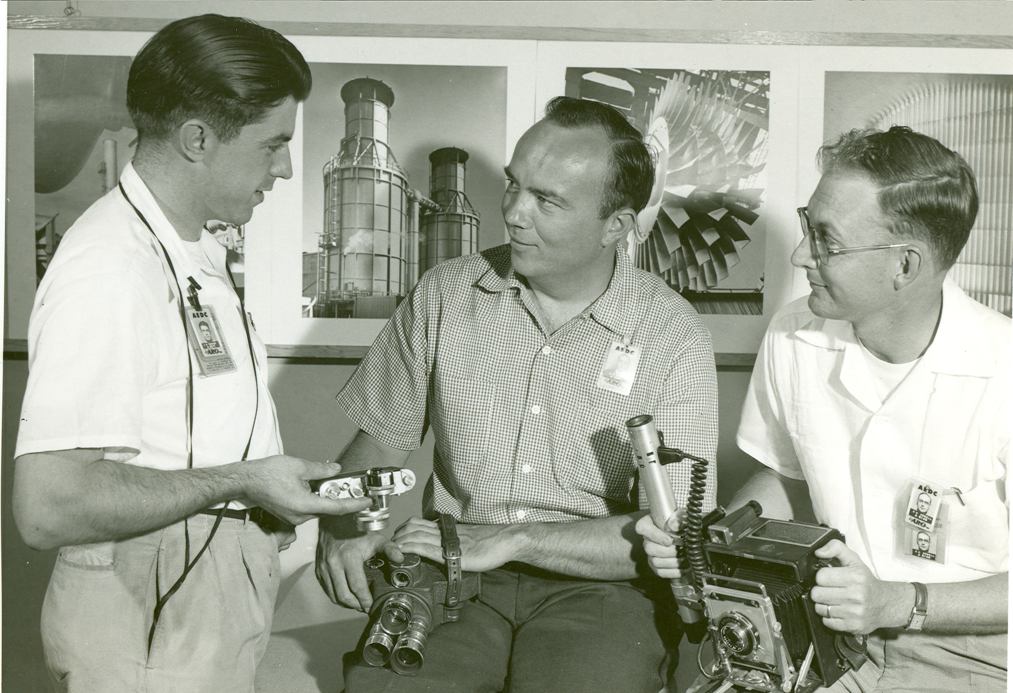 By 1956 Phil Tarver was joined by R. Pierson Smith and Charlie Powell who helped him with photographing the important events and people associated with the frenetic pace of flight simulation testing at AEDC. The team captured newsworthy and often iconic images on film, both photographic stills and movies. (AEDC historical photo)
