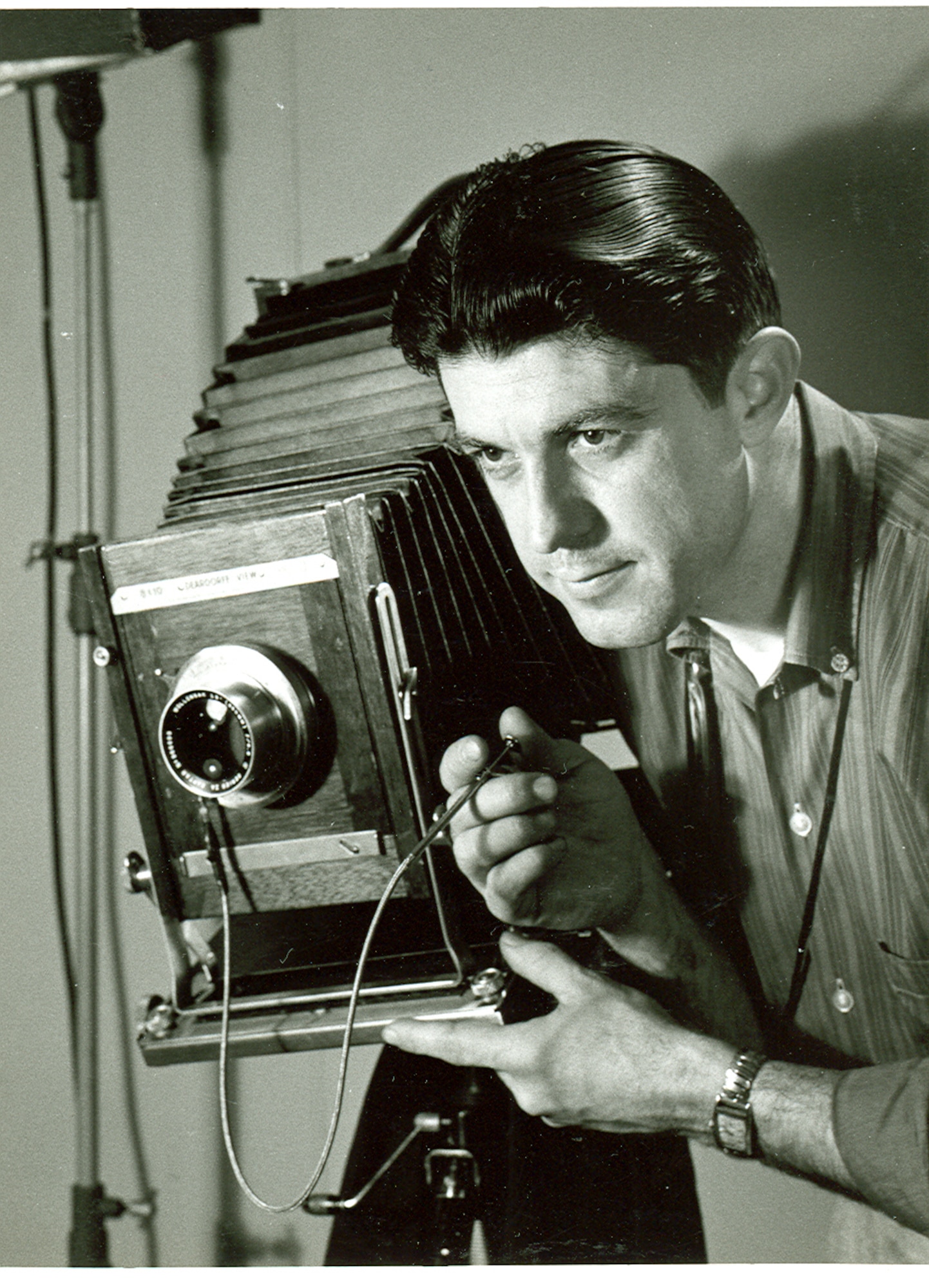 Phil Tarver with a Deardorff view camera in an informal work portrait taken at AEDC in 1958. (Photo provided)
