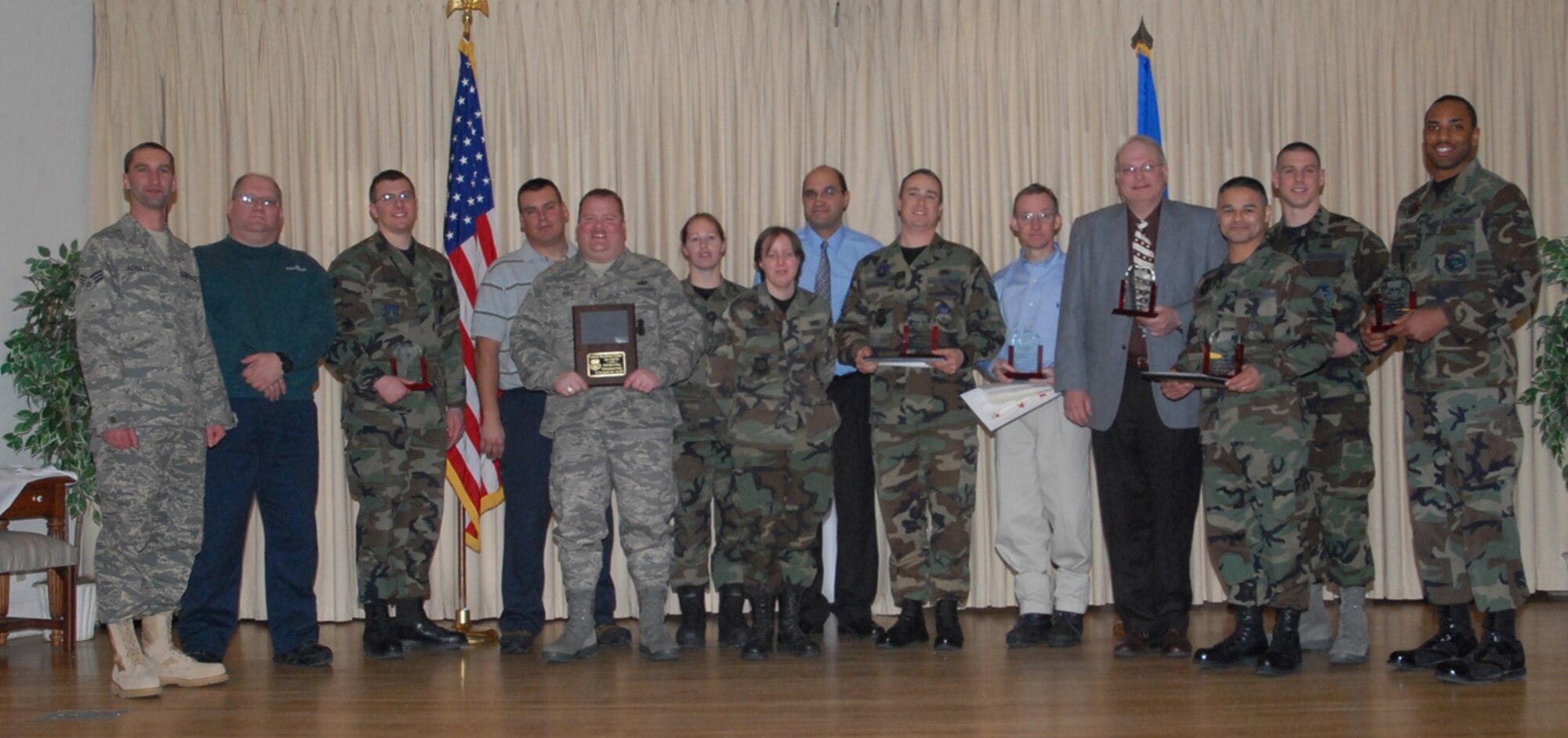 Members of Team Malmstrom selected as the 4th Quarter Award winners are pictured following the awards breakfast at the Grizzly Bend Club Jan. 23. From left to right are: Senior Airman Nathan Schultz and Doug Hove, 341st Security Support Squadron vehicle readiness center, who were part of the team award; Senior Airman Michael Fellows, 490th Missile Squadron, Airman of the Quarter; James Steffenson, Tech Sgt. Anthony Keel, Staff Sgt. Annette Atkinson, Senior Airman Stephanie Trosper and Mike Elliot, the remaining 341st SSPTS team winners (Mr. Elliot was also selected as the Category I Civilian of the Quarter); Tech. Sgt. Robert Turnbow, 341st Logistics Readiness Squadron, NCO of the Quarter; David Dower, 341st Civil Engineer Squadron, Category II Civilian Supervisor of the Quarter; Fred Rauch, 341st Space Wing, Category II Civilian of the Quarter; Master Sgt. Timoteo Silva, 341st Operations Group, Senior NCO of the Quarter; 1st Lt. Adam Baker, 341st Missile Security Forces Squadron, Company Grade Officer of the Quatrer; and Senior Airman Walter Falls, 341st Services Squadron, Honor Guard of the Quarter. (U.S. Air Force photo/Christy Mason)