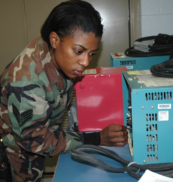 Staff Sgt. Ieshia M. Williams, 919th Maintenance Squadron aircraft electro-environmental systems journeyman, runs a "battery" of tests on a new battery in her shop. To ensure optimum performance, each battery is inspected, cleaned and tested for discharge capacity and leakage. She is also responsible for the inspection and maintenance of liquid oxygen bottles, life raft bottles, and all the electrical and environmental systems on an MC-130E Combat Talon I aircraft, such as generators and lighting. Off duty, she is the manager of Floridadelphia Cheesesteak and Hoagie Factory in Panama City, Fla. She is working toward her engineering degree at Gulf Coast Community College and in her spare time enjoys outdoor recreation and playing with her dog. She is this month's Sharp Troop. (U.S. Air Force Photo/Master Sgt. Buffy Galbraith)