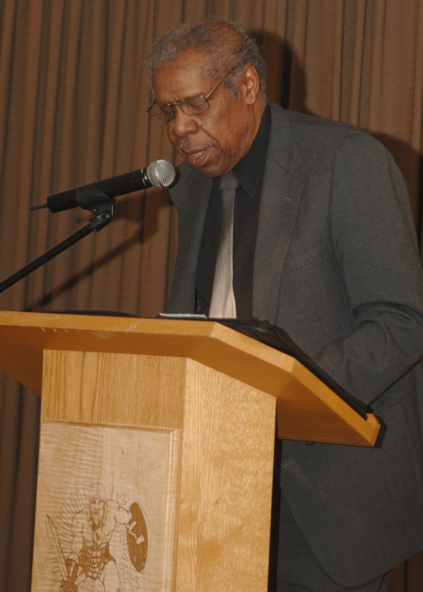 Mr. David Collins, retired Senior Master Sergeant, speaks at the Martin Luther King Jr. luncheon at the Northern Lights Club January 22 . During his speech, Mr. Collins recalled the accomplishments of Dr. King and challenged the attendees to honor Dr. King’s memory by embracing the spirit of positive change and suggested several volunteer and community service opportunities. (Photo/ SrA Chad Kellum)
