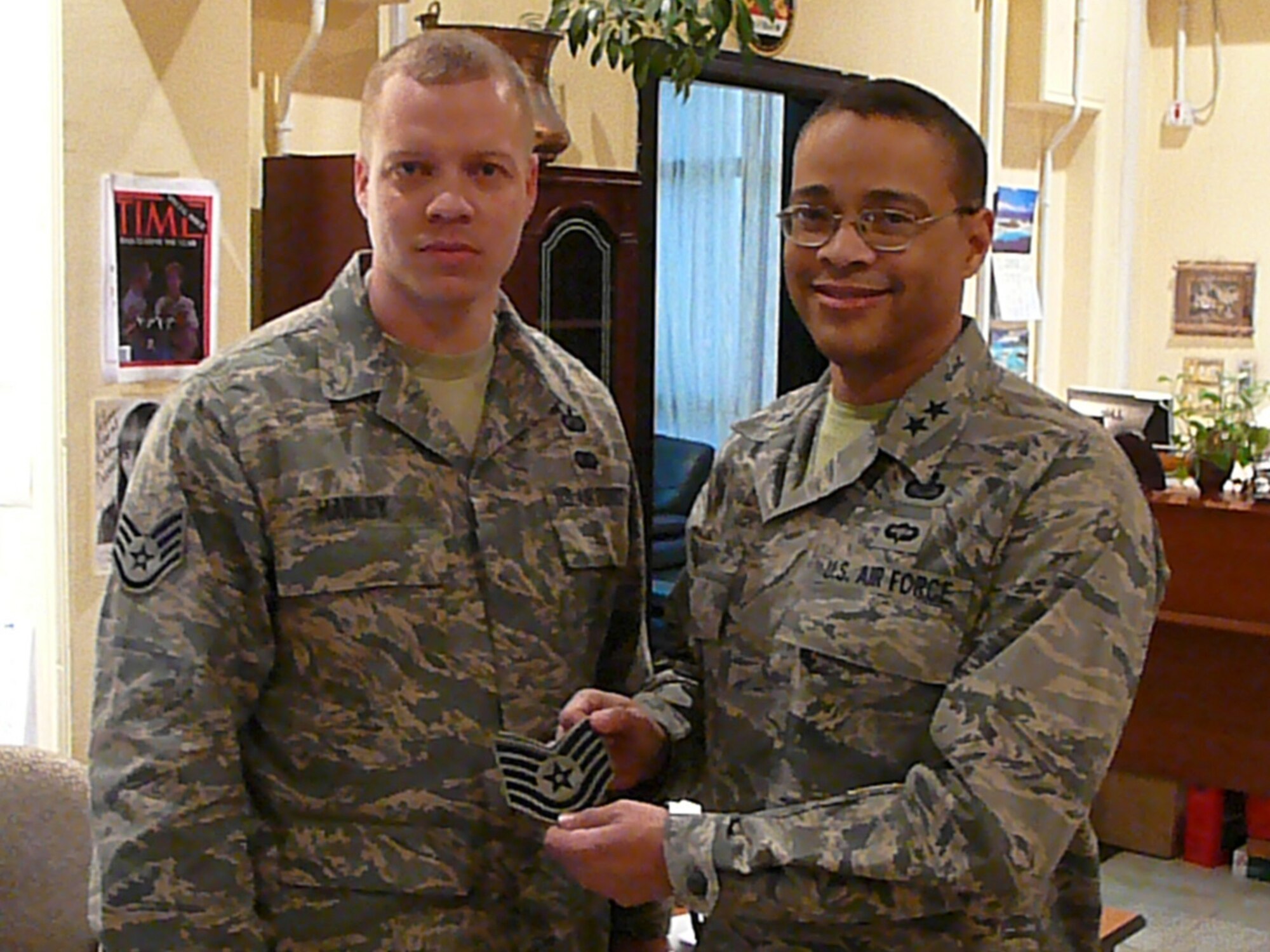 LANGLEY AIR FORCE BASE, Va. -- Tech. Sgt. Devin Harley, a contingency contracting officer at the Baghdad International Zone, was promoted under the Stripes for Exceptional Performers program by Maj. Gen. Darryl Scott, commander of the Joint Contracting Command-Iraq/Afghanistan, Baghdad, Iraq, Jan. 16. Sergeant Harley is deployed from Langley’s 1st Contracting Squadron. Brig. Gen. Mark Barrett, 1st Fighter Wing commander, attended Sergeant Harley’s promotion via teleconference. (U.S. Navy photo/Lt. Cmdr. Anthony Grow) 