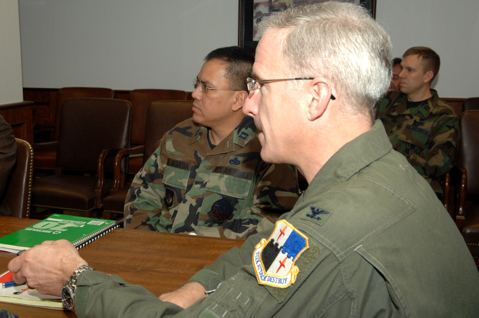 SPANGDAHLEM AIR BASE, Germany – Capt. Angelo Agueda, 52nd Component Maintenance Squadron, sits in on a meeting with Col. Thomas Feldhausen, 52nd Fighter Wing vice commander, Jan. 23, 2008. Captain Agueda spent the day with Colonel Feldhausen as part of the Commander’s Shadow program. The captain the 52nd CMS propulsion flight commander, is a native of West Covina, Calif. (U.S. Air Force photo/Senior Airman Logan Tuttle) 