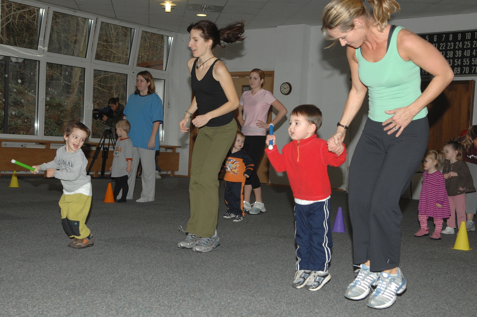 Renee Champagne, (right), does a fitness activity with her son, during the Mommy and Me Yoga and Fitness class, Jan.18, at the Vogelweh Community Center. Renee is the instructor for the class. (U.S. Air Force photo by Senior Airman Megan M. Carrico) (RELEASED)

