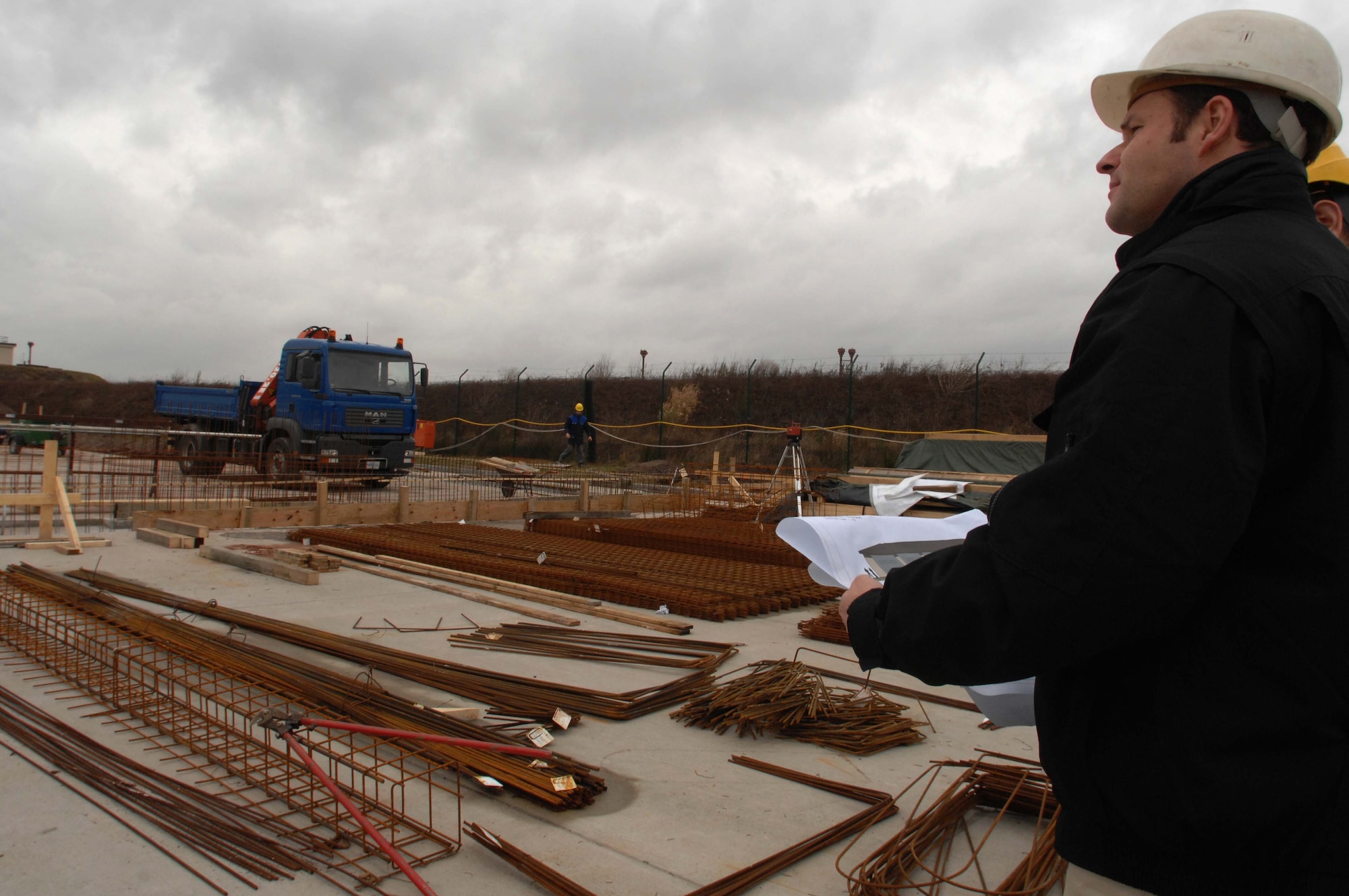 Ralf Schrade, 86th Construction and Training Squadron project manager, looks over the construction of the new Deployable Joint Command and Control Center for the 1st Combat Communications Squadron, Jan. 18, on Ramstein Air Base. The DJC2 is scheduled to be finished this summer.

The environmentally friendly facility will house a maintenance bay to test palletized and vehicle-mounted communications equipment in simulated field conditions, a laboratory for  testing electronics, and training. (U.S. Air Force photo/Airman 1st Class Amber Bressler)(RELEASED)


