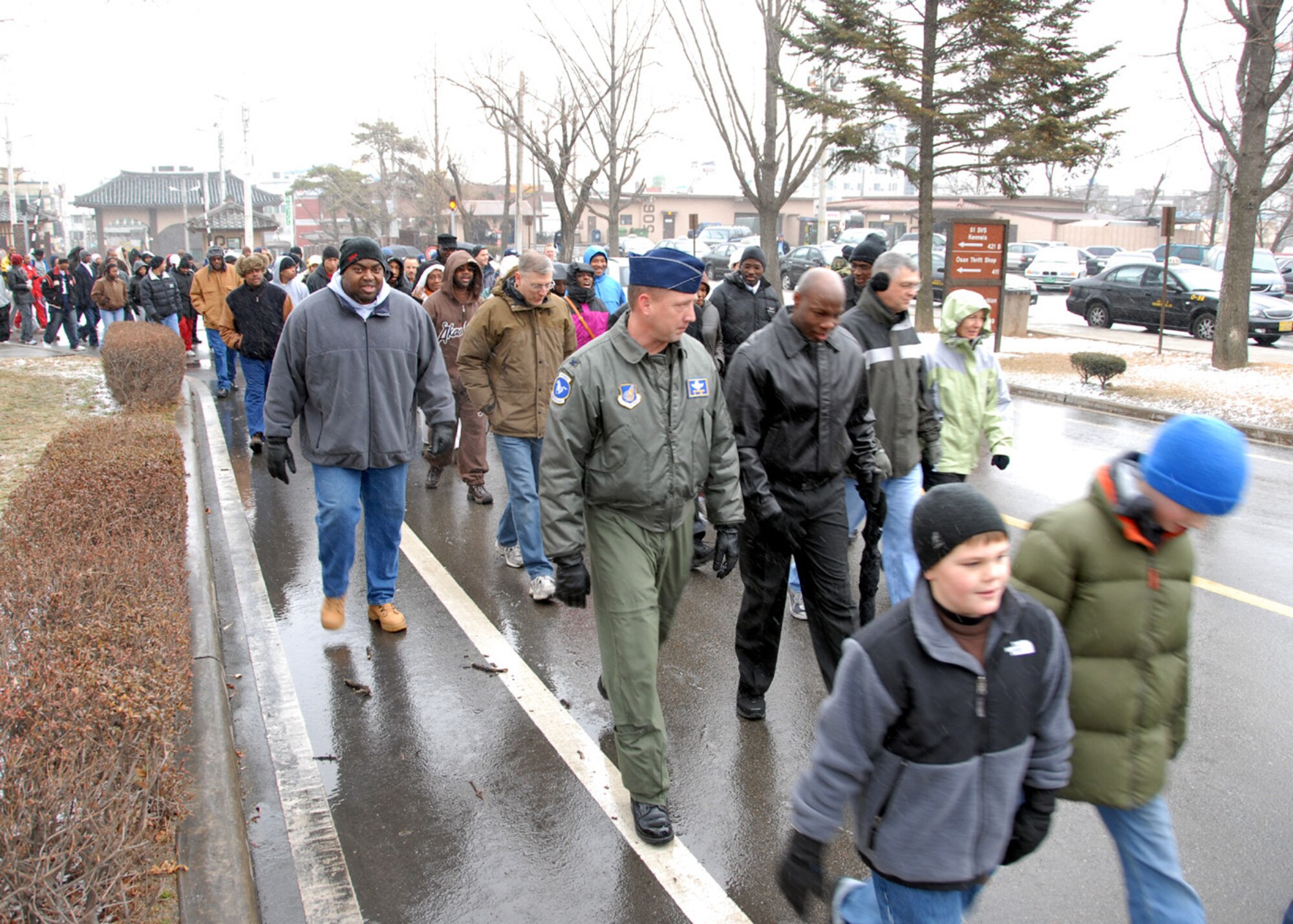 OSAN AIR BASE, Republic of Korea -- Team Osan members participate in Dr. Martin Luther King Jr. Day's commemorative march from Osan's main gate to the base chapel.  (U. S. Air Force photo by Senior Master Sgt Marvin Krause)