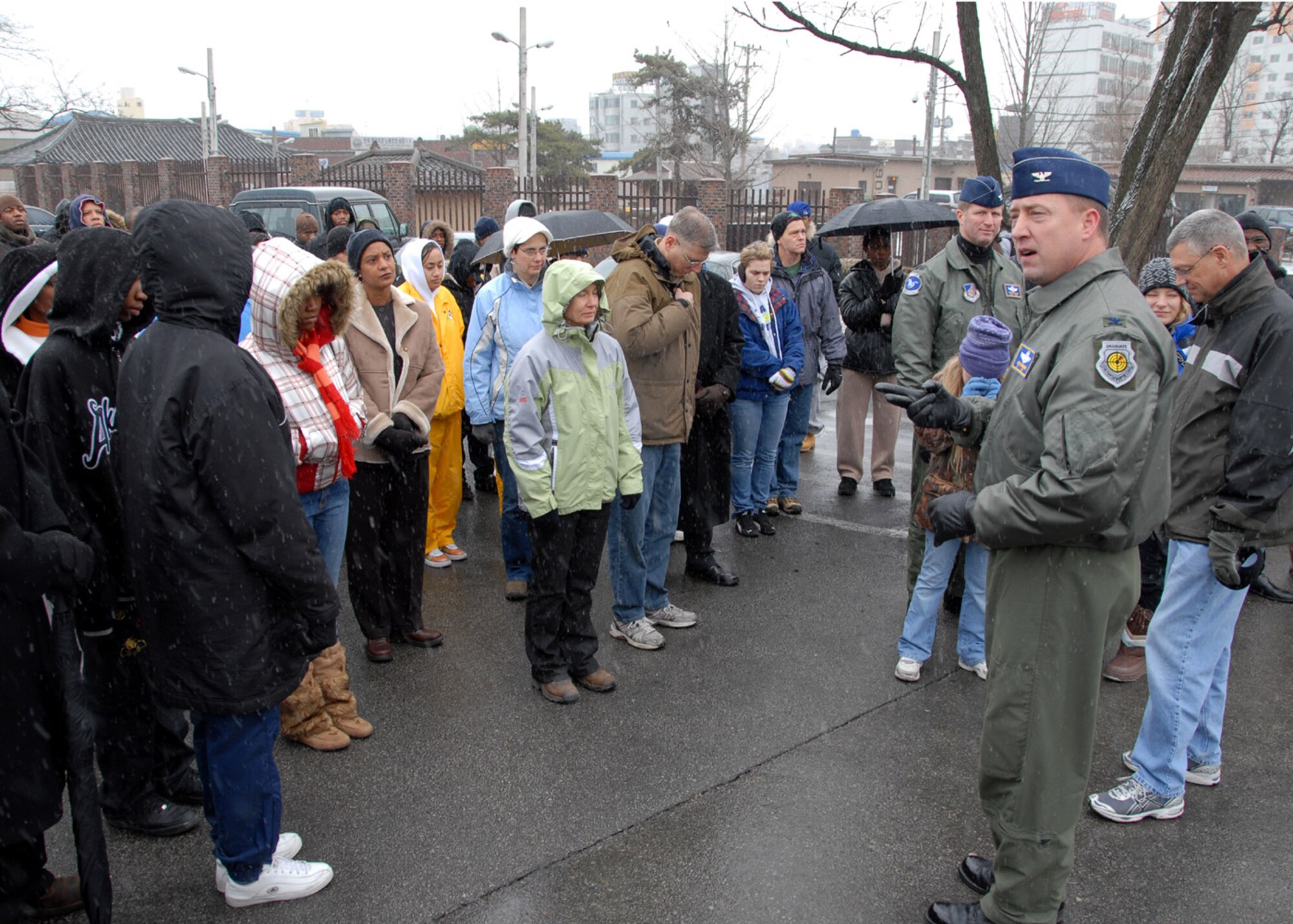 OSAN AIR BASE, Republic of Korea -- Colonel John A. Norman, 51st Fighter Wing commander, provides opening remarks to Team Osan members during Dr. Martin Luther King Jr. Day's commemorative march from Osan's main gate to the base chapel.  (U. S. Air Force photo by Senior Master Sgt Marvin Krause)