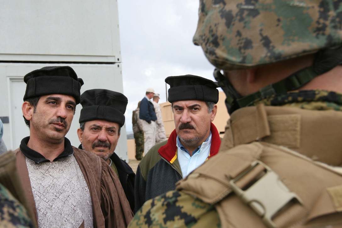CAMP PENDLETON, Calif., (January 24, 2008) -- Marines from India Battery, Battalion Landing Team 2/5, speak with the mayor and other city officials in order to assess the city's situation during a humanitarian assistance operation exercise at Kilo 2 Area Combat town here. The Marines were tasked with providing security during the HAO Exercise in support of the 15th Marine Expeditionary Unit during its MEUEX. MEUEX is a series of exercises designed to prepare the 15th MEU for its upcoming planned deployment. (Official USMC Photo by Cpl Kevin N. McCall) (Released)