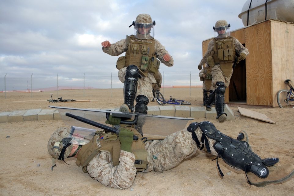 CAMP BUEHRING, Kuwait (Jan. 27, 2008) ? Marines with G Battery, Battalion Landing Team 1st Battalion, 5th Marine Regiment, 11th Marine Expeditionary Unit, practice self defense techniques during a non-lethal weapons training course here. The 11th MEU, stationed at Camp Pendleton, Calif., is taking part of sustainment training here during their scheduled six-month deployment through the Western Pacific and Arabian Gulf region.