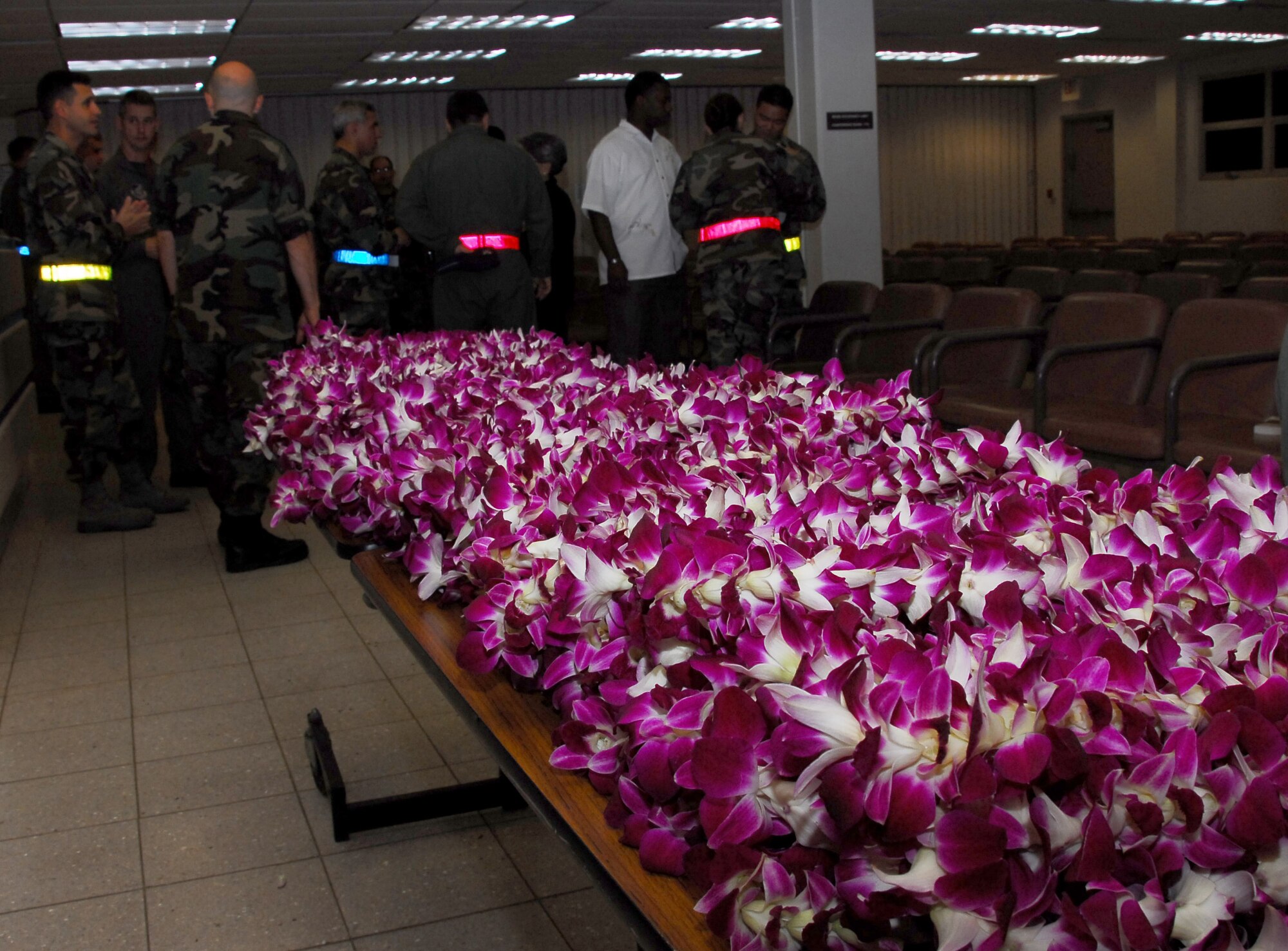Each returnee was welcomed with  warm Aloha to include a lei. Photo by Ed Foster.