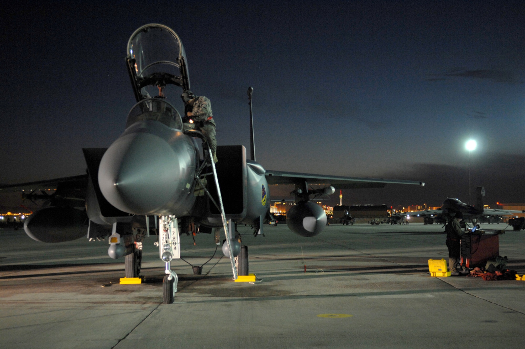 NELLIS AIR FORCE BASE, Nev.—Airman 1st Class Anthony Prewitt, a crew chief from the 366th Fighter Maintenance Squadron, Mountain Home AFB, Idaho, performs a post-flight inspection on his F-15E Strike Eagle after a mission during Red Flag 8-2.1, here Jan. 23. Red Flag is a two-week long multi-national exercise training pilots in the world’s most realistic combat scenarios. The experience gained during the exercise is vital to the survival of pilots in combat. (U.S. Air Force photo by Master Sgt. Robert W. Valenca)